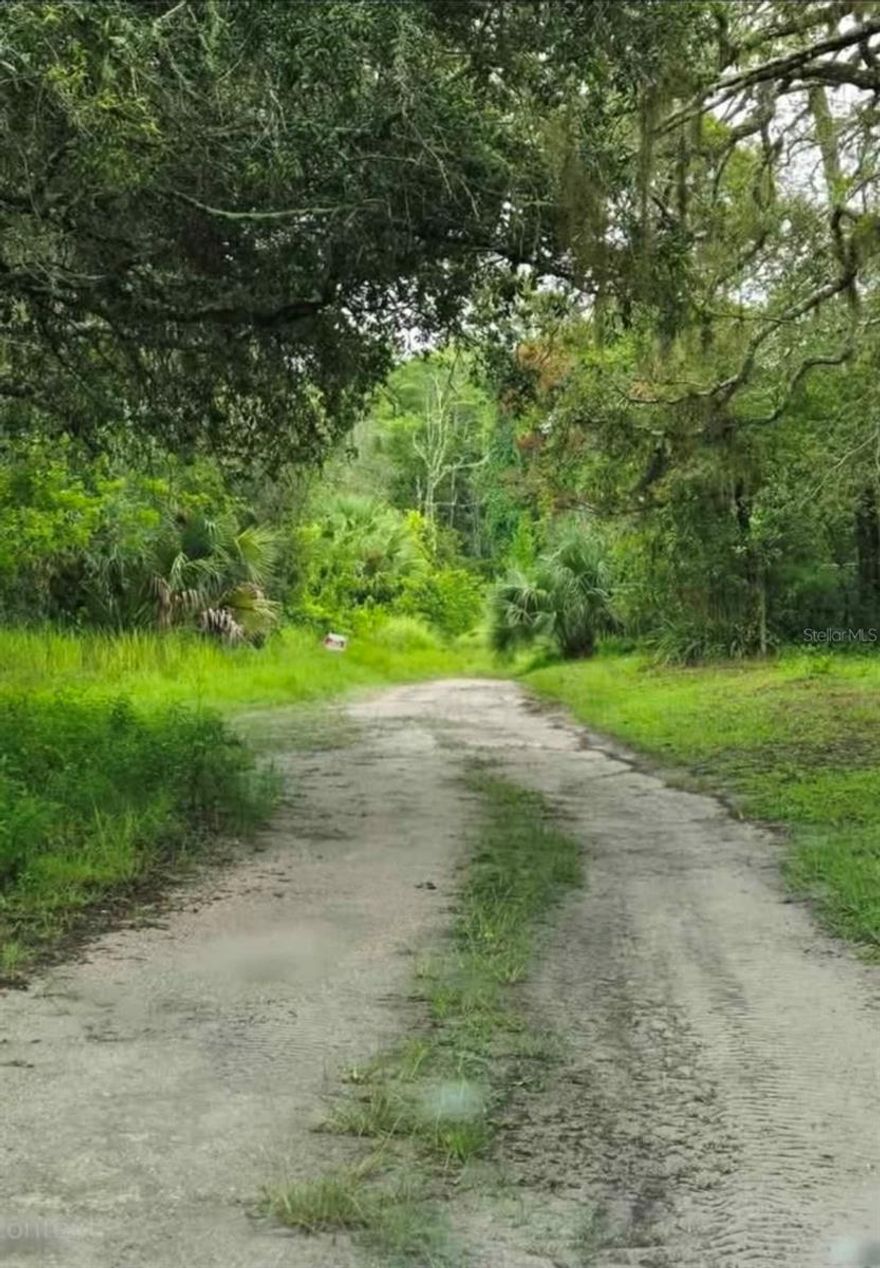 Residential lot for sale. Wooded, unimproved. Paved road with other homes next door and across the street. 7700 sq ft. Single family, Mobile, or Manufactured homes allowed. No HOA, flood zone or wetlands.  There is no address yet