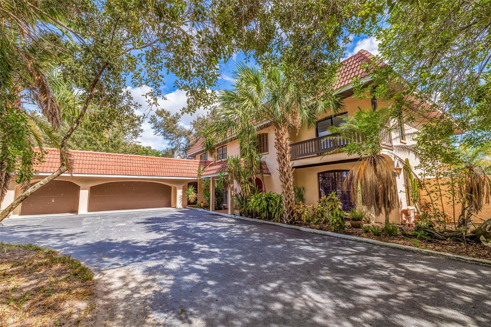 The Skyway Equestrian Center is on the market! This nearly 5 acre horse ranch is located in Palmetto, Florida, and is just waiting for your equestrian needs. The property is 4.9 Acres and is board fenced and cross fenced. The meandering paved driveway leads you around a pond with a footbridge to a 3,967 Sq. Ft. 2 story 5 bedroom, 3 bath, Mediterranean style home with barrel tile roof trin and flat roof and a 3 car attached garage. Home has a large eat-in kitchen and great room with a wood burning fireplace and an impressive entrance foyer. The kitchen has modern appliances, tile and island. Floor coverings are carpet and tile. upstairs are spacious bedrooms and an elevated deck spanning the width of the house. Out back has a big screened in porch overlooking the firepit, paddock, Vinyl clad log cabin guest house and barn. The cabin is 1 Bedroom, 1 bath and great room with modern kitchen. This cabin can be a guest quarters or residence for a farm manager. The crowning touch to this unique property is the 20 stall Horse Barn with tack room, 1/2 bath and water to the stalls. The barn has pavers for the common area floor and the stalls are full sized. The back of the barn leads to a fenced training circle. The location is a short drive to Interstate 275 and is equidistant to Tampa, St. Petersburg and Sarasota-Bradenton. Research indicates that a full service horse stall can rent in this area for $800-$1,000 per month. This is a real winner-You do the math. All sizes are approximate.