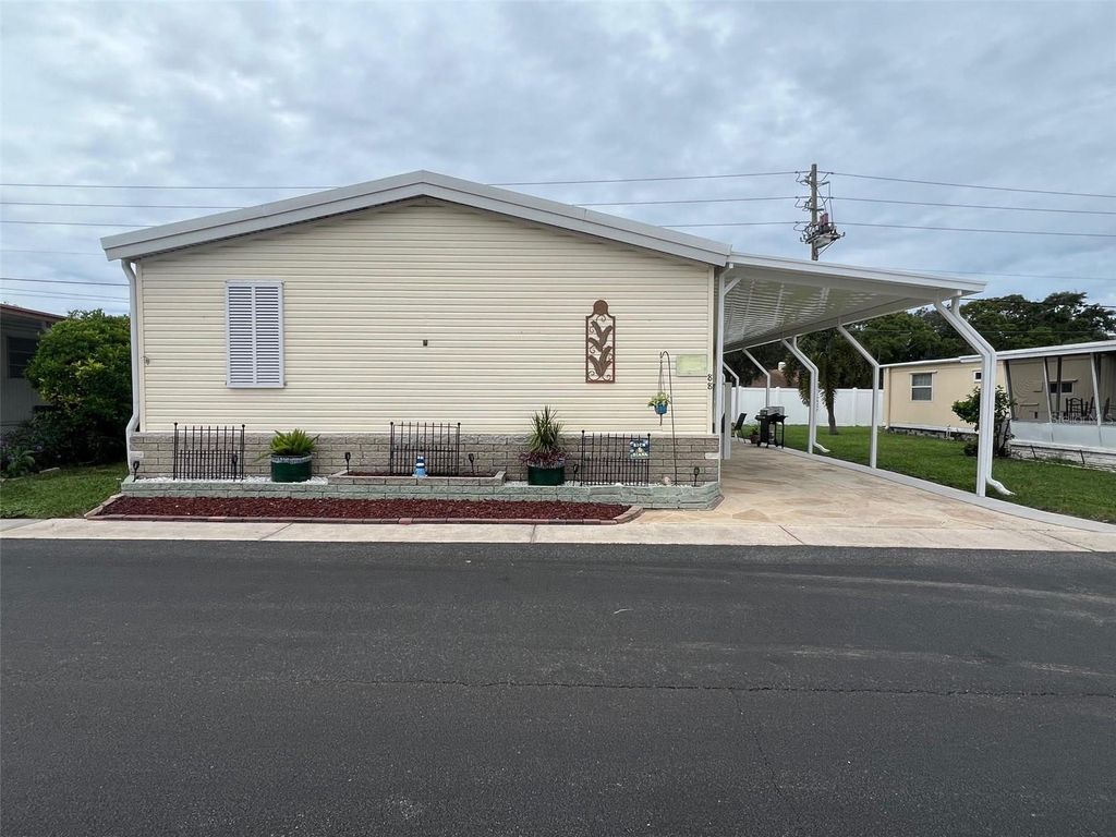 Photo of 88 Pindo Palm Street W, Largo, FL 33770 (MLS # TB8427522)