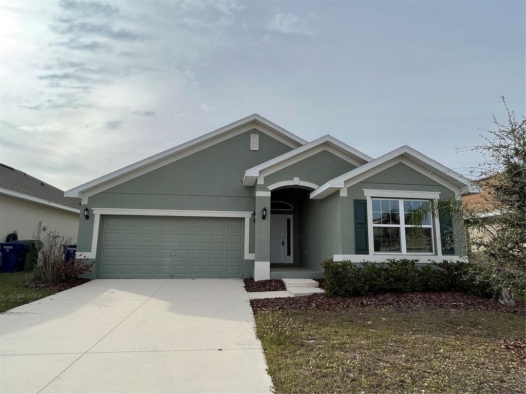 Photo of 136 Krenson Bay Loop, Winter Haven, FL 33881 (MLS # O6417045)