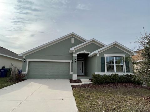 Photo of 136 Krenson Bay Loop, Winter Haven, FL 33881 (MLS # O6417045)