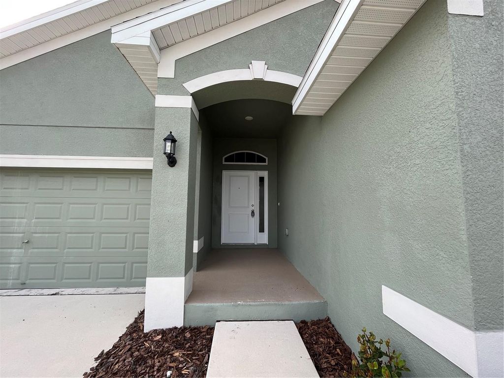 Photo of 136 Krenson Bay Loop, Winter Haven, FL 33881 (MLS # O6417045)