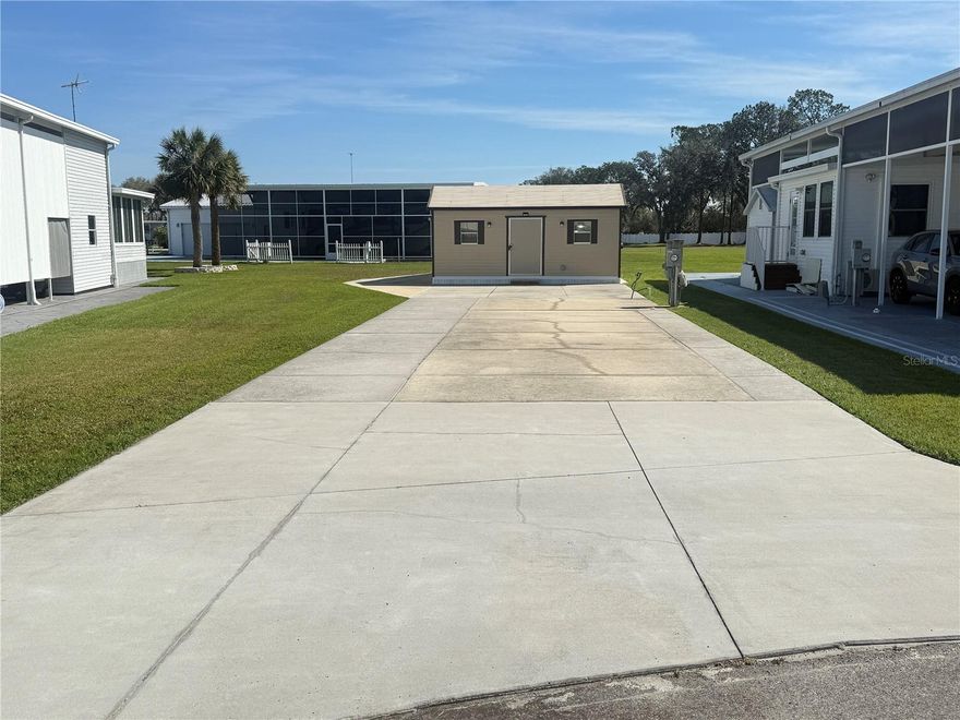 Discover the exceptional opportunity to own an extra-large Class A motorhome lot situated on a serene cul-de-sac in Phase 1 of Mount Olive Shores community. This property features a spacious concrete slab that can easily accommodate any size Class A motorhome, complemented by full public utility hookups that include both 50 and 30 Amp service.

Enhancing the appeal of this lot is a nearly new, fully insulated, and recently upgraded 10' x 20' shed. This functional space is equipped with a new washer and dryer, a utility sink, and an InstaHot water heater, ensuring all your needs are met. The shed also boasts a convenient roll-up garage door, perfect for securely storing your golf cart. With HOA approval, you have the exciting option to expand your outdoor living space by adding a 10' x 20' porch or screened enclosure.

This lot provides ample room not only for your RV but also has the potential to accommodate a manufactured home and an RV Port, giving you greater flexibility in your living arrangements. Mount Olive Shores is known for its warm, friendly atmosphere and offers a safe, gated environment just minutes away from I-4. Enjoy proximity to a variety of shopping outlets, world-class medical facilities, and both Tampa and Orlando International Airports. Plus, you'll find the renowned attractions of Central Florida are less than an hour from your doorstep.

Keep in mind that Mount Olive Shores is a deed-restricted community exclusive to Class A motorhomes, and owning one is a requirement during your first year of accumulated residency. Seize this rare opportunity to become part of a vibrant community and start your next adventure today!