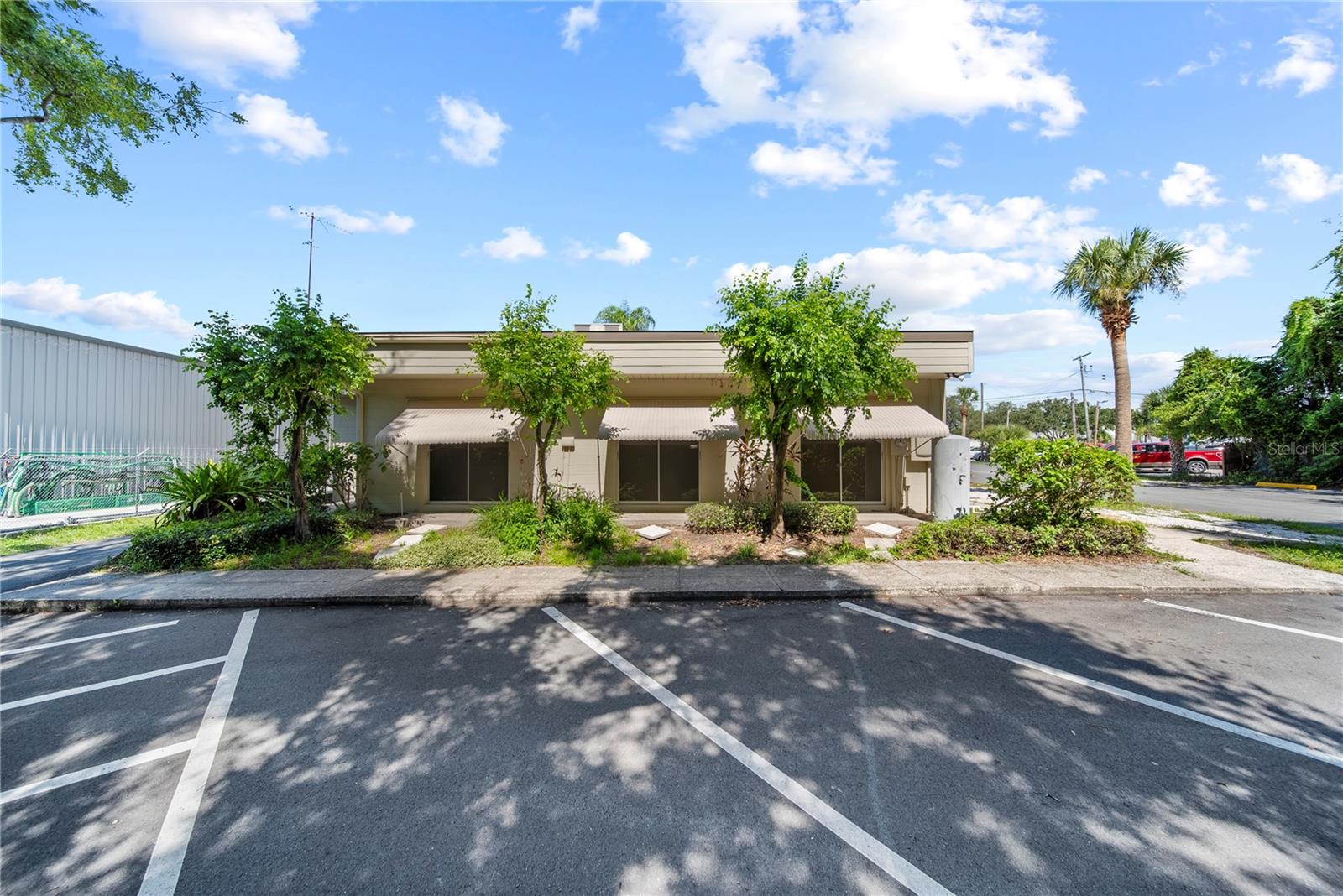 Located only a 2-block walking distance from Advent Health North Pinellas Hospital, this spacious and professional 2200 sf Office Building on almost 3/4-acre land parcel with a prime front exposure on High Visibility Alt US 19 /S Pinellas Ave, Tarpon Springs, FL is now available for sale in a ready-to-move-in condition. Perfectly positioned along this high-traffic corridor, this versatile space is ideal for a medical office, and equally suitable for legal, real estate, financial services, or any professional business seeking excellent exposure and functionality. Key Features include EXCELLENT SIGNAGE and visibility on S Pinellas Ave with strong daily traffic counts, FUNCTIONAL LAYOUT with a mix of private offices, open work areas, reception area, conference room, break room/kitchenette, and ADA-compliant restrooms, AMPLE ONSITE PARKING, and Modern finishes with abundant natural light. Zoned for professional and general office use and situated just minutes from downtown Tarpon Springs and the Sponge Docks, this property offers a strategic location with easy access to major highways, restaurants, and local amenities. Schedule a private showing today! READY TO USE AS IS OR DEVELOP A LARGER STRUCTURE FOR ANY COMMERCIAL USE. ALSO AVAILABLE FOR LEASE; please see MLS # TB8411249