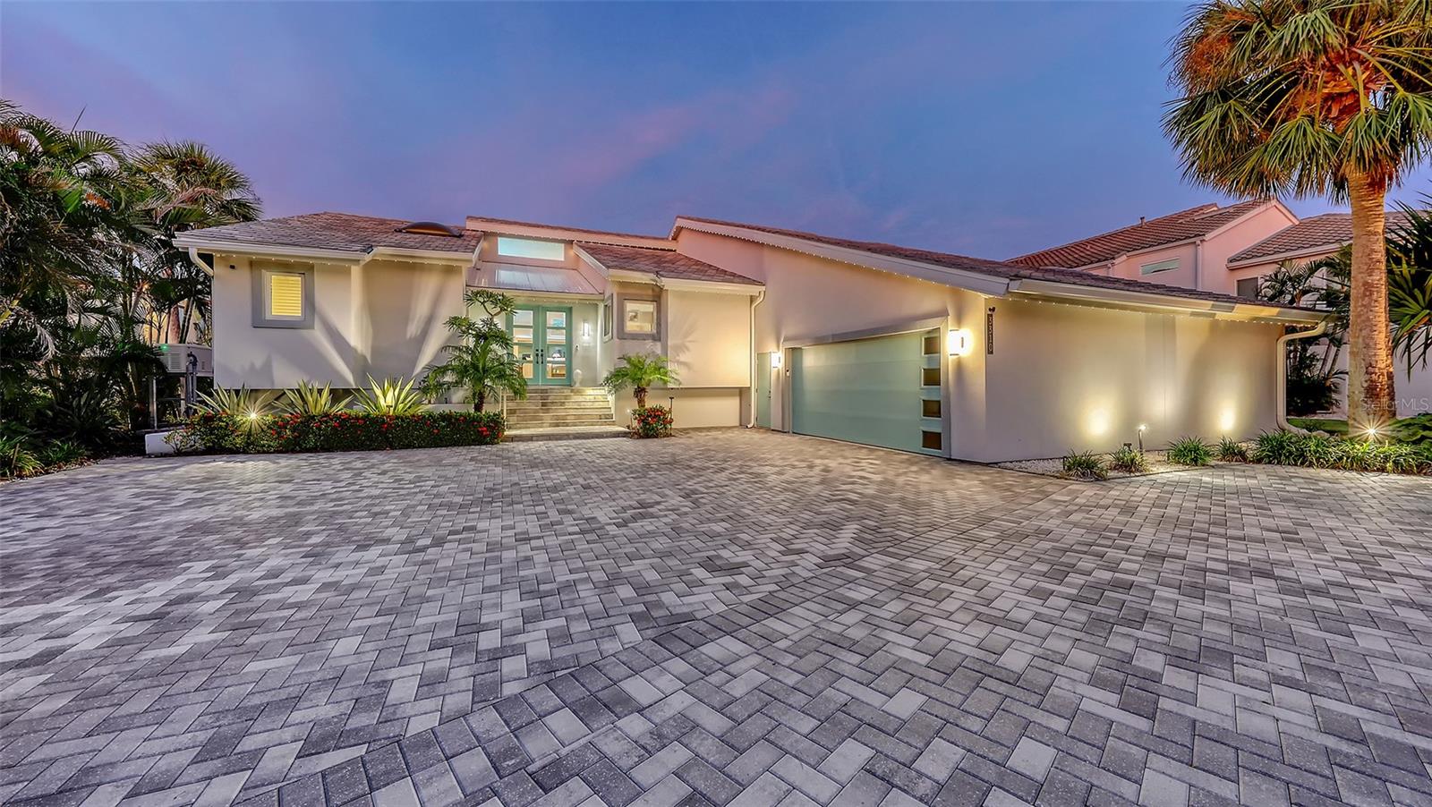 Artfully Curated, Fully Reimagined Lakefront Estate in Bay Isles
This is not just a home—it’s a curated piece of art. Set behind the exclusive 24-hour guarded gates of the Longboat Key Club in the sought-after Bay Isles community; this residence has been completely reimagined from the ground up. Taken down to the studs and rebuilt with all-new electrical, plumbing, HVAC, and impact-rated windows and doors, this one-level home offers nearly 3,000 square feet of effortless luxury.
Situated on an expansive 16,000+ square foot lot at the end of a private cul-de-sac, the property enjoys unobstructed views of a tranquil lake where swans glide and otters play. From nearly every room, you’ll feel as if you’re floating on a private yacht, surrounded by nature and beauty, with no neighboring homes in sight—just shimmering water and spectacular sunrises.
The tropical grounds were designed by a local landscape architect, featuring rare and exotic trees, custom landscape lighting, and garden paths that glow under nightfall. A newly updated pool area with travertine stone, an outdoor kitchen, and hurricane-impact screen enclosure creates an idyllic retreat. Perimeter accent lighting ‘Trimlite’ along the roofline adds an architectural glow after dark.
Inside, wide 9-inch white oak hardwood planks run throughout the home. The state-of-the-art kitchen is a showpiece, Devittori custom designed and installed cabinets and outfitted with Thermador’s finest: a steam oven, coffee center, warming drawer, wine fridge, and built-in appliances—all surrounded by exquisite countertops and a waterfall island. The ambiance is elevated even further with Hue smart lighting systems throughout the home, allowing you to set the perfect mood in every room.
Every inch of this residence was thoughtfully planned and executed with uncompromising attention to detail. A newly installed 3-zone HVAC system (2024), whole house generator, spacious two-car garage with epoxy floors, dedicated storage, and a 220V EV charging station. Every bathroom and space within the home has been finished with the highest level of craftsmanship and elegance.
Enjoy the unmatched lifestyle of Bay Isles, with deeded access to the private Bay Isles Beach Club, and the convenience of nearby Publix, dining, banking, and wellness amenities—all just moments from your front door.
This is a rare opportunity to own a truly one-of-a-kind home on Longboat Key