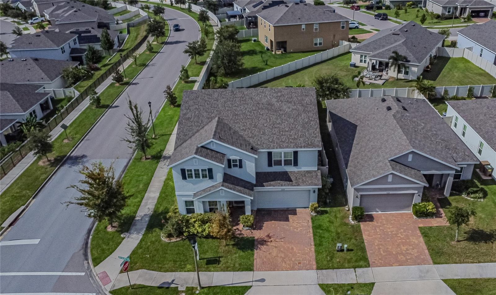 Welcome to this spacious 5-bedroom, 3-bath, two-story residence in the highly sought-after Cypress Oaks community of Groveland—just minutes from Clermont! Nestled on a premium corner lot in a serene neighborhood with low HOA fees and no CDD, this beautifully upgraded home offers the perfect blend of modern living, comfort, and functionality. Step into a welcoming foyer that opens to a versatile flex space ideal as a home office, media room, game room, or formal living area. The open-concept kitchen, dining, and family room is the heart of the home, featuring a large granite island, stainless steel appliances, walk-in pantry, and plenty of room to entertain or create cherished family memories. Conveniently, there's a bedroom and full bath on the first floor, perfect for guests or multigenerational living. Upstairs, you’ll find four additional bedrooms, including a spacious loft-great as a second living area or playroom. The grand primary suite offers a luxurious retreat, complete with an oversized walk-in closet, dual vanities, and a glass-enclosed shower. The second-floor laundry room has been thoughtfully upgraded with a utility sink and wire shelving for extra convenience. Step outside to your private backyard oasis, fully fenced with upgraded vinyl fencing and custom pavers throughout—ideal for outdoor gatherings and low-maintenance enjoyment. All of this is located just minutes from Lake Hiawatha, Lake Minneola, Lake Memory, downtown Clermont, HWY 50, HWY 27, shopping, dining, and more. Don’t miss the opportunity to make this move-in-ready home yours—schedule your private showing today!