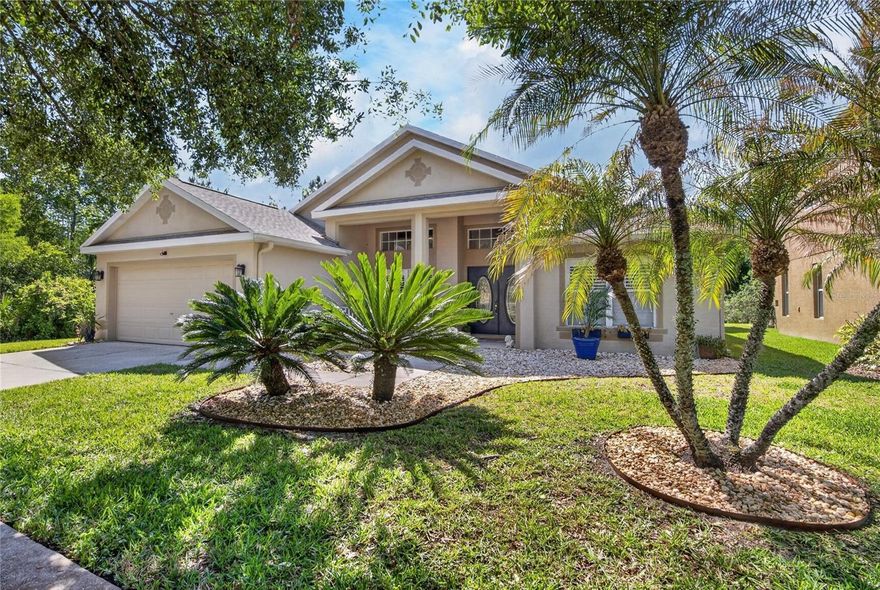FROM A BRAND-NEW ROOF TO LUXURY VINYL PLANK FLOORS, this updated and upgraded home stands out in many ways -- but most of all for its wonderfully wooded privacy in the back of West Meadows Preserve! Come home to this gated enclave feeling far from the crowd at the end of a lane lined with trees instead of other homes! The backyard view is southeast so as the sun sets in front of the property, instead of squinting in the late afternoon heat, you can watch rays dapple conservation land from the shade of a 32-foot-long screened lanai. Cardel Homes' Sterling design provides more than 2,600 SF with front living and dining rooms, back family room featuring gas fireplace, extended kitchen with flexible dinette space (as well as a walk-in pantry, center island, serving bar and corner nook), 2 bathrooms, 4 bedrooms, plus an upstairs bonus that can be almost anything from a 5th bedroom or recreation room to an office or personal gym. Quality finishes and amenities include wood, tile, stainless-steel, arches, columns, art shelves and insets, chair rails, enhanced moldings, decorator fans and fixtures, faux wood shutters, and a leaded-glass double-door entry from the inviting front porch. Current owners refinished the kitchen cabinets this year with a deep tone that complements the granite counters and glass-tile backsplashes. They significantly remodeled the master bedroom suite with emphasis on the bathroom, removing a Roman-style tub in favor of a beautifully tiled shower and new vanities with undermount sinks in stone counters. Other recent improvements are those LVP floors through almost the entire home, a Halo water conditioner, a pull-down ladder and attic flooring above the 2-car garage -- and the expensive, dimensional-shingle roof installed just a few weeks ago. All of these details enhance the property's appeal, of course, but remember too that it's in The Preserve at West Meadows! It's part of a sprawling, popular community with resort-style pools, playgrounds, sports courts and fields, a clubhouse with fitness center, dog park, walking trails and more near good schools, shops, restaurants, services, as well as transportation routes to Tampa, Gulf beaches and beyond. Visit today and see if this is where you want to be!