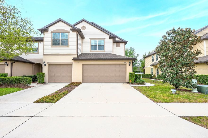 Welcome to this BEAUTIFULLY MAINTAINED END-UNIT townhome in the GATED COMMUNITY of Emerson North in Apopka, offering over 1,700 SQUARE FEET of stylish and functional living space. Built in 2018, this home feels fresh and modern, with a MOVE-IN READY interior and a desirable TWO-CAR GARAGE. Step inside to discover a bright, OPEN-CONCEPT LAYOUT where the Living Room, Dining area, and Kitchen flow seamlessly together, all complemented by EASY-TO-MAINTAIN CERAMIC TILE FLOORING throughout the main level. The GENEROUS Kitchen is designed to impress, featuring abundant cabinetry, GRANITE COUNTERTOPS, a sleek tile backsplash, stainless steel appliances, a closet pantry, and a SPACIOUS BREAKFAST BAR—perfect for both everyday living and entertaining. A CONVENIENT HALF BATH is located just off the Kitchen. The Dining area transitions effortlessly into the Living Room, where sliding glass doors lead to a PRIVATE SCREENED and ENCLOSED PATIO, creating a relaxing outdoor retreat where you can enjoy views of the backyard. A VINYL PRIVACY FENCE along the rear offers a peaceful and low-maintenance setting. Upstairs, you’ll find the three CARPETED Bedrooms along with a CONVENIENT LAUNDRY CLOSET complete with washer and dryer. The Primary Suite offers a comfortable retreat, featuring a WALK-IN CLOSET and EN SUITE BATH with dual sinks and a step-in shower. Two additional bedrooms share a GENEROUS FULL BATH with dual sinks and a tub/shower combination, providing plenty of room for family or guests. Residents of Emerson North enjoy a GATED community setting with GREAT AMENITIES, including a community pool, playground, park, and maintenance of the exterior, grounds, and pool, making for easy, LOW-MAINTENANCE LIVING. Conveniently located near the natural beauty of Wekiwa Springs State Park, you’ll have EASY ACCESS to outdoor adventures like hiking, kayaking, and biking. Shopping, dining, and entertainment are JUST MINUTES away in APOPKA and nearby ALTAMONTE SPRINGS, while major roadways such as State Road 429 and U.S. Route 441 make commuting to Orlando and surrounding areas QUICK AND CONVENIENT. With its modern design, END-UNIT PRIVACY, and PRIME LOCATION, this Emerson North townhome provides the perfect combination of comfort, convenience, and lifestyle. Now is the time—don't miss your chance to call this home!