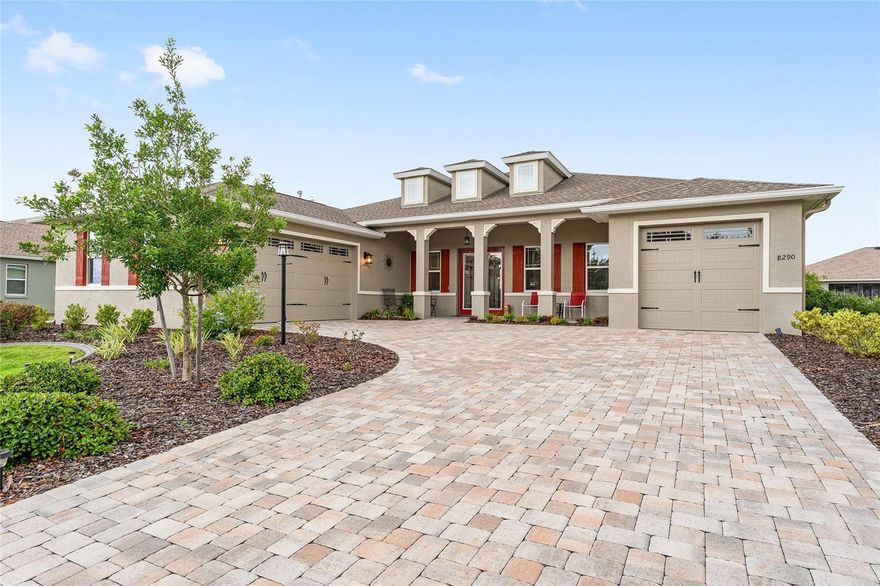 Welcome to 8290 SW 92nd Circle in the West Kestrel neighborhood of Candler Hills in Top Of The World!  Greeted by the professional landscaping and the welcoming front porch, you know you are home!  You will enjoy the special touches the sellers made to this highly desired Aberdeen Model.  Like many new homes, you need to look for the added value items done by the seller to make it their home.  The neutral choices they made will let you move right in! The Aberdeen has three bedrooms and three baths with two primary suites plus a den/flex room. The home has so many desired standard features, along with many items added at the Design Center: Ceramic plank flooring throughout the home, Drywall with round corners, Neutral gray paint in every room, Dovetailed drawers and upgraded hardware throughout the home. 
In the kitchen: Crown molding added to the 4 level staggered kitchen cabinets, three-drawer bank was added replacing cabinet doors, and in addition, the home has a beautiful 112” x 54" island featuring Cambria Quartz/Summerhill countertops with a bull nosed edge.   Two solar tubes were installed above the island!  As a bonus the island has disappearing electrical outlets that will pop up when needed and stay out of the way for a clean look!  Electrical outlets with dedicated switches were added above the cabinets. The neutral backsplash with mastic grout and tile edged trim are timeless.  Of course, the cabinets have pullout drawers for your convenience!  The GE thirty-six-inch six burner gas range will handle cooking needs. Clean-up is easy with the GE forty-five decibel stainless tub dishwasher.  A highly rated top-of-the-line LG refrigerator is also included. There is a solar tube added to the kitchen plus another down the hall leading to the third car garage. 
Ceiling fans are found throughout the home, lanai and garage.  In the great room, the seller added recessed lighting, a floor outlet and a dedicated twenty-amp outlet for an electric fireplace.  In the Flex room there is recessed lighting and low voltage media wiring for TV, Internet and phone. Custom lanai solar shades are also included!  The owner added Levelor blinds with remote drapery and hardware in the great room and dining room and owner’s suite. 
The enclosed lanai has a level floor to the great room and a twenty-four-inch knee wall.  Seller also added a GFCI outlet plus a ceiling fan with lighting along with painted walls.  Outside the lanai enjoy the professionally landscaped beds with concrete edging plus a 38x10 patio area for your outdoor entertainment! 
As you might expect, the bathrooms are over the top! The owner’s suite has beveled edge mirrors, three drawer bank, 1x3 herring bone designed shower floor.  All three baths have upgraded 10x14 tiled shower walls and Delta fixtures. 
The laundry has upgraded laundry cabinets with a sink base, granite countertop with bull nosed edge, top-of-the-line LG washer and dryer, 220 Volt outlet at dryer and drop-in laundry tub and faucet. 
  Outside you will find the rich-looking paver driveway, professional landscaping with curbing. The seller added gutters and leaders to move rainwater away from the home.  This home has over $100k in options between the seller and design center. You will not find these special touches in a new construction at this affordable price!  Thinking of building? Look here first and be amazed with what this home offers at this price! HSA Home Warranty is included Call Today!