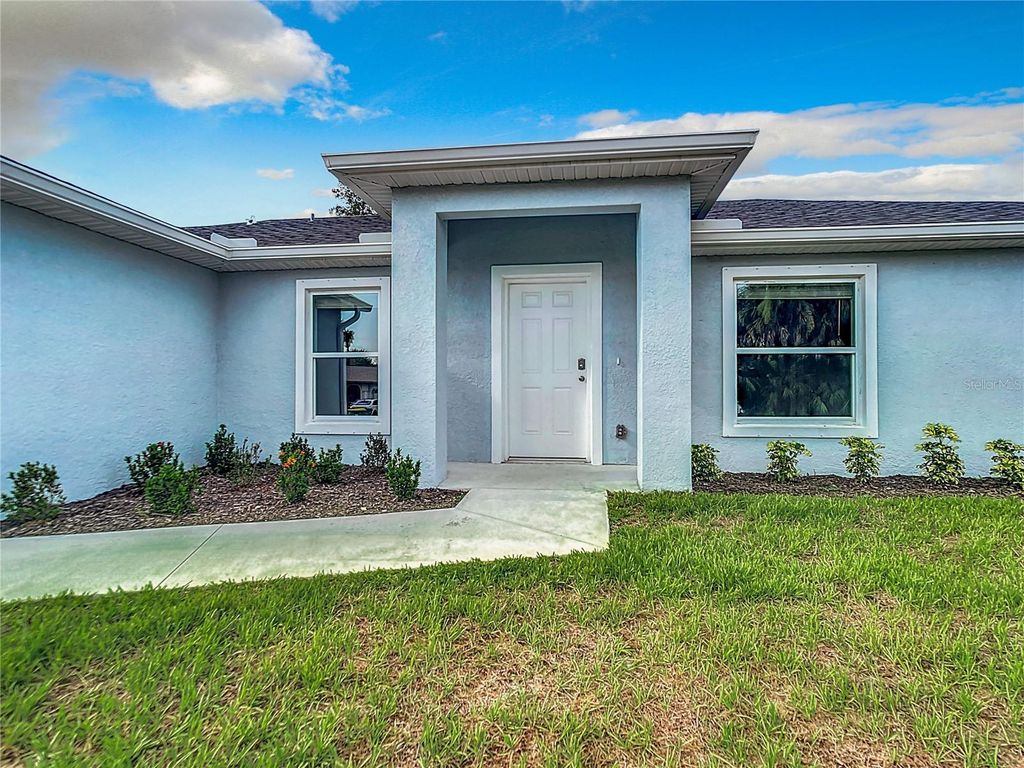 Photo of 1193 NW Victoria Avenue, Port Charlotte, FL 33948 (MLS # OM707795)