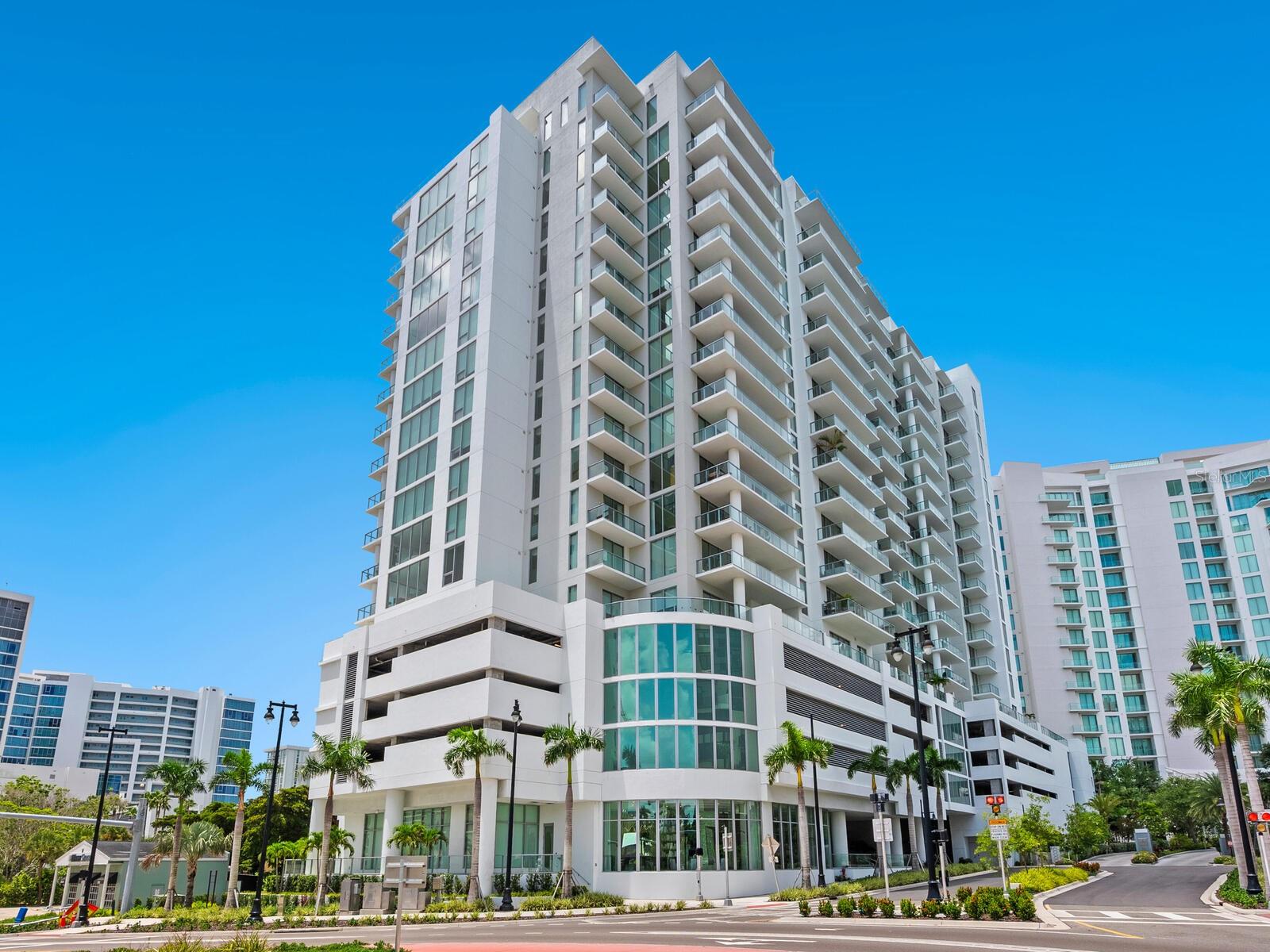 Experience the vibrant Sarasota Downtown Quay/THE BAY condo lifestyle at BAYSO, now available for ANNUAL RENTAL. This 2-bedroom + den, 2.5-bath residence offers stunning views of Sarasota Bay and the city skyline. Enjoy an open floor plan with 10-foot ceilings, floor-to-ceiling impact-rated windows and sliding doors. The residence features imported 24" x 48" porcelain tile flooring, designer finishes, and custom automatic shades. The open kitchen is equipped with Jenn-Air Professional stainless-steel appliances, quartz countertops, European cabinetry, and a spacious center island for relaxed dining and living. The primary suite includes a custom walk-in closet and a spa-like ensuite bath with a frameless glass enclosure, Grohe fixtures, and European cabinetry. The secondary bedroom also has an ensuite bath. A generously sized den offers flexible space for a home office, media room, or guest quarters. Additional features include an in-unit laundry room with washer, dryer, sink, and cabinetry, a designated storage unit, and one assigned parking space. Bayso offers world-class amenities, including 24/7 front desk attendants, controlled access entry, overnight security, stylish club room, state-of-the-art fitness center, and a movement studio. For professionals, there's a well-appointed business center with a boardroom, private workspaces, and drop-in areas. Outdoors, enjoy the resort-style heated pool and spa, gas grills, poolside lounge, and secure bike storage. Ideally located between downtown Sarasota's cultural energy and the scenic John Ringling Bridge to St. Armand's Circle and Lido Beach. Bayso offers a unique walkable lifestyle. Just steps from Ocean Prime and nearby Bay Park with 53 acres of waterfront greenspace, music concerts, and community events. Whole Foods, theaters, galleries, and Sarasota’s award-winning restaurants and boutique shopping are a short walk away. This is downtown Sarasota luxury living at its finest, perfectly positioned for everything the city has to offer.