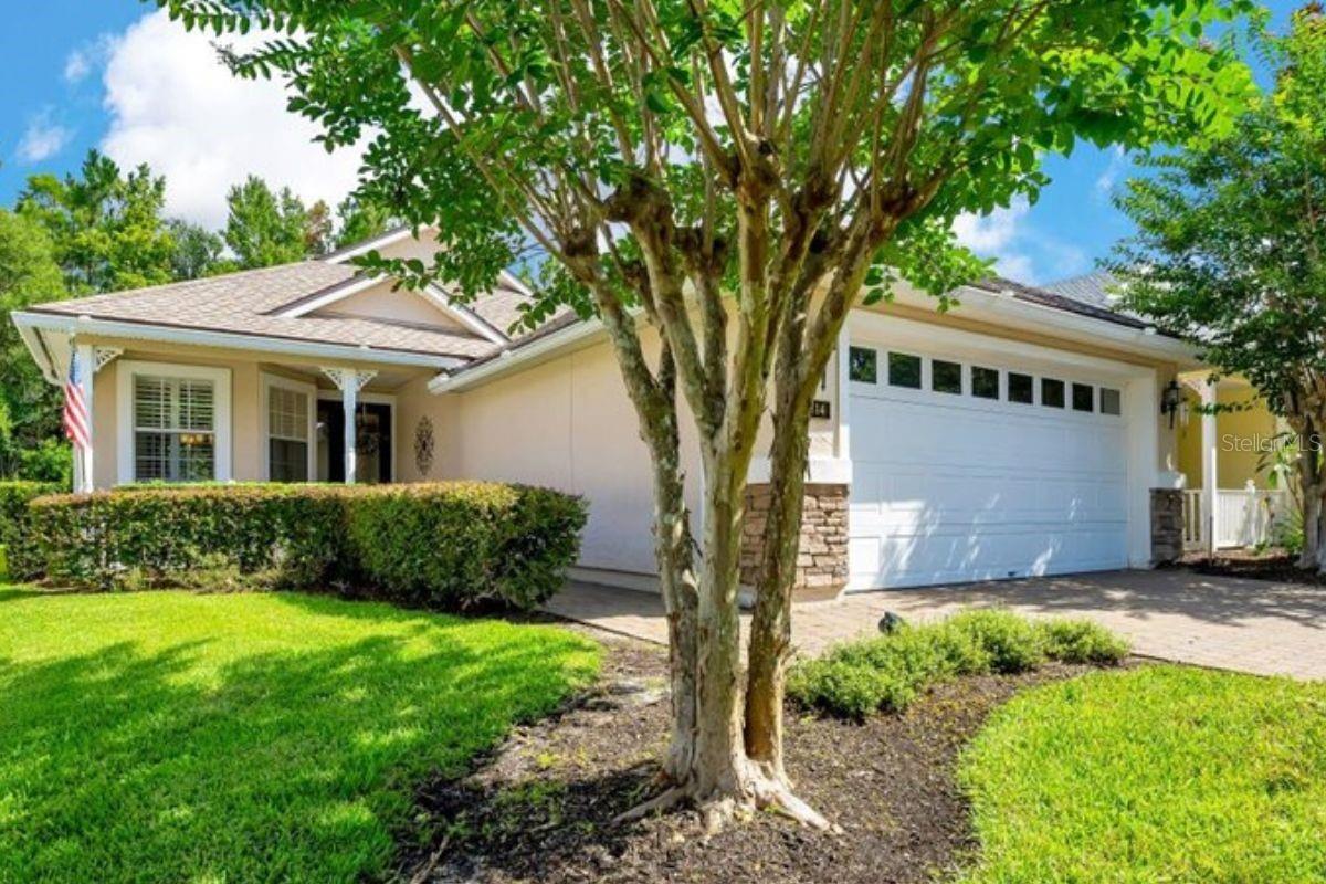 Yes, you can live in a luxurious gated community and have wildlife wander out of the FOREST into your back yard. If you are looking for LUXURY mixed with nature, you will find it here. This 2 bath, 2 bed plus a large BONUS ROOM home features dramatic CATHEDRAL ceilings, QUARTZ countertops, WALK-IN closets, a covered front porch, and OVERSIZED CASCADING TRIPLE SLIDING DOORS leading to a soaring SCREENED back PATIO overlooking the mature woods behind the home. High ceilings including cathedral height in the master give you plenty of room to breathe. The master bath features DOUBLE VANITIES with tons of counter space and a private water closet. Closets and STORAGE are everywhere including a storage room in the TWO CAR GARAGE. To finish it off, everything is new or newer - NEW HVAC, NEW WATER HEATER, 2019 ROOF. Thoughtfully designed, and beautifully painted, each room gives the feeling of a five star experience. World Golf Village offers a heated indoor POOL, outdoor POOL & patio area, hot tub and covered party pavilion, over 4 miles of sidewalks for walking, jogging and/or biking as well as the beautiful path around Blue Heron pond, FITNESS CENTER, community center, tennis & PICKLEBALL courts, bocce, croquet & shuffleboard courts, and a putting green. Come see how this home stands out from the rest - we think you'll love it.