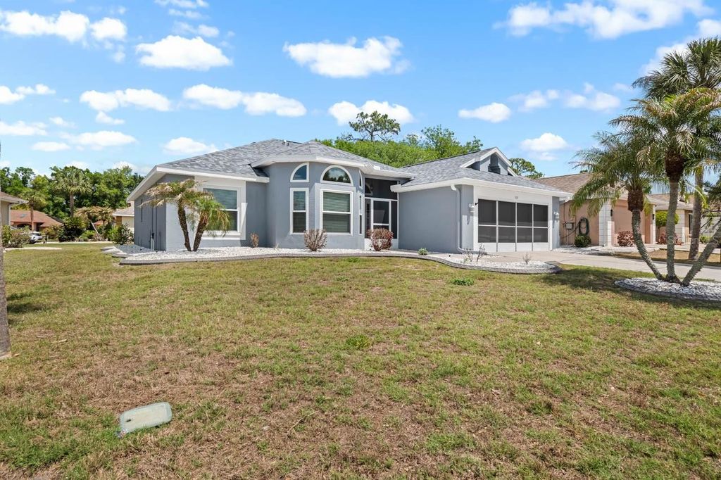 Photo of 327 Caloosa Woods Lane, Sun City Center, FL 33573 (MLS # TB8487945)