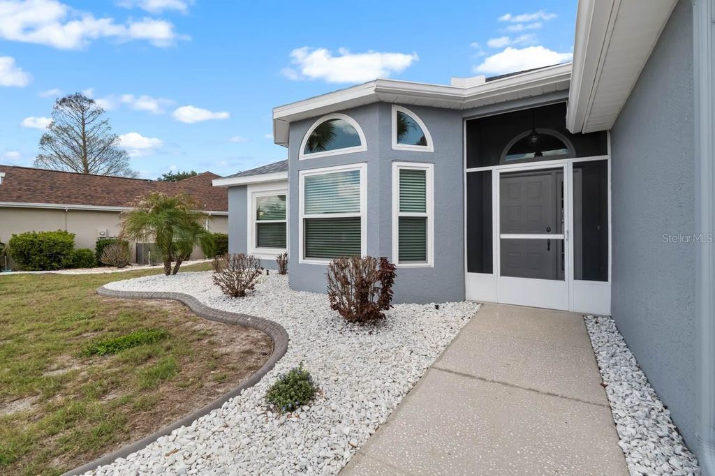 Photo of 327 Caloosa Woods Lane, Sun City Center, FL 33573 (MLS # TB8487945)