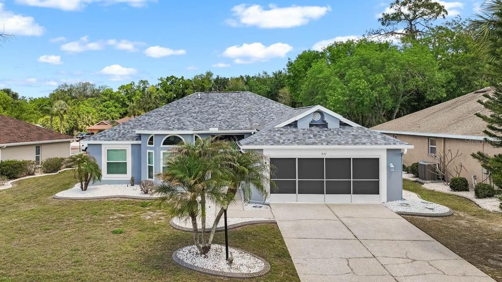 Photo of 327 Caloosa Woods Lane, Sun City Center, FL 33573 (MLS # TB8487945)