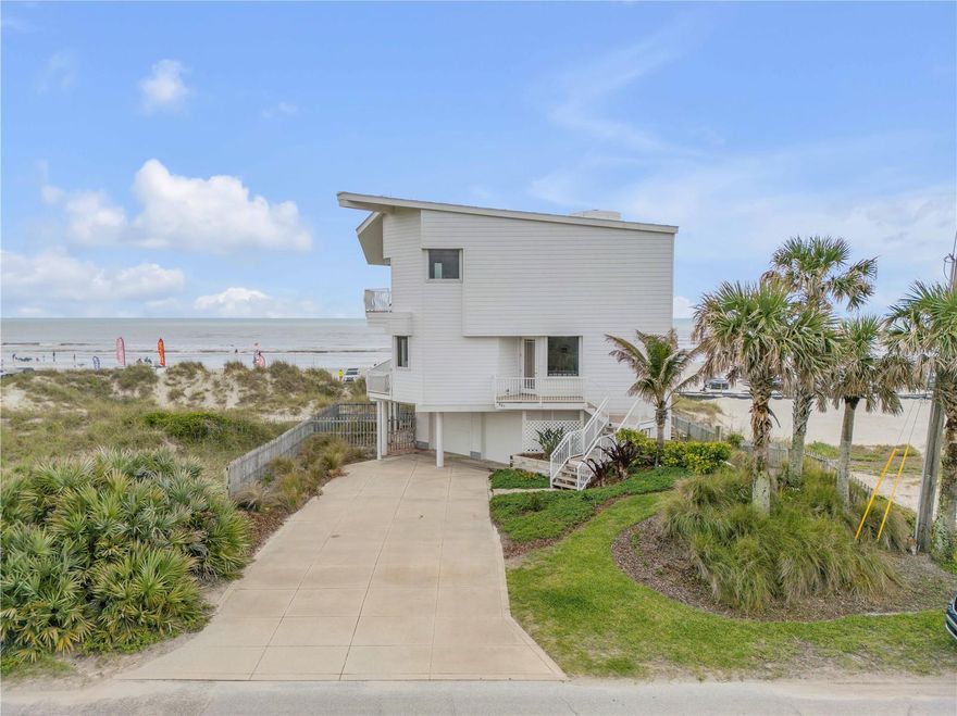 Direct Oceanfront Home. This 3-bed, 3-bath breathtaking contemporary beach home with an oversized 2-car garage is on a corner lot, giving it the appearance of a private island retreat. Designed by Bruce Krall, this iconic 3-story concrete pier fortress offers uninterrupted views of the ocean, sunrises, and surf from walls of windows and multiple balconies.
With east-west doors open, enjoy constant ocean breezes that make every day feel like a vacation. The home features Rolladen storm shutters (regularly maintained) and a new 2024 roof. The ground level includes garage parking, laundry, utility sink, storage, outdoor patios, and space for a dog run.
A turret stairwell leads to the open-concept second floor with sweeping ocean views. A chef's kitchen with bamboo cabinetry, glass backsplash, honey-toned granite, Sub-Zero fridge/freezer, Fisher & Paykel dishwashers, dual ovens, warming drawers, and a 5-burner gas range, walk-out to a patio ready for a gas grill. One full bedroom and bath complete this level.
The top floor features a spacious oversized ocean front  primary suite with vaulted ceilings, built-ins, walk-in closet, a primary bath with dual glass sinks, soaking tub, and separate shower. A third ensuite bedroom is located at the southwest corner of the 3rd floor.
Private beach walkover and a short stroll to Flagler Avenue’s shops and dining. This is exceptional oceanfront living.