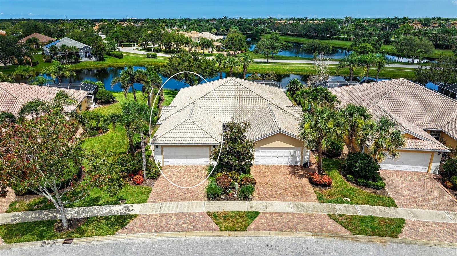 Resort-style living close to beaches, shopping, and restaurants! This maintenance-free villa, nestled within the gated and highly desirable community of Islandwalk, has been meticulously maintainted by the original owners. Seller is offering a HOME WARRANTY AND COVERAGE OF CAPITAL CONTRIBUTION FEE! The beautifully landscaped private entrance welcomes you home. With its sunny southern exposure, the interior is bright and cheerful throughout the day. Enjoy quiet evenings at home or entertain guests with ease in the open, inviting layout. The kitchen features abundant storage and a convenient breakfast bar, while the dining room is ideal for formal gatherings. From the dining area and private lanai, take in tranquil views of the sparkling lake.Wake up to peaceful lake views in the spacious primary suite, which boasts a large window, a generous walk-in closet with built-in shelves, and ample space. The split bedroom arrangement ensures privacy for both you and your guests. For added peace of mind, Accordion Shutters are installed on every window and are easily activated. Lifestyle is the key word here! Islandwalk offers two clubhouses with resort-style and lap pools, spas, fitness centers, 12 lighted pickleball courts, 8 Har-Tru tennis courts, basketball, bocce ball, a dog park, and miles of scenic trails. Beyond the gates, you’re just minutes away from Manasota Beach, Venice Beach, and charming downtown Venice with its shops, restaurants, and theater. Nearby, enjoy the excitement of the Atlanta Braves' spring training at CoolToday Park and the vibrant Wellen Park community with shopping, dining, kayaking, and more.Whether you're looking for a full-time residence or a seasonal retreat, this is the perfect place to call home!