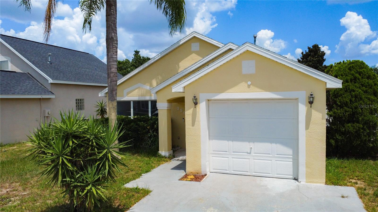 Welcome to 250 Belvoir Drive- a delightful three-bedroom home nestled in the gated community of Royal Ridge. This move-in-ready property is ideal for first-time buyers or savvy investors, offering a bright and open layout designed for comfortable Florida living. Enjoy the durability and easy upkeep of tile flooring throughout, with each bedroom providing generous space for rest and privacy—perfect for families or guests. Step outside into the expansive 30x10 screened lanai, a peaceful retreat for relaxing evenings or weekend gatherings. The fully fenced backyard adds extra privacy and security, ideal for pets. Recent upgrades include a brand-new roof, a new water softener system, and solar panels installed with no cost to the new owner for this energy-saving feature. Conveniently located near Posner Park’s shopping and dining options, and just minutes from Heart of Florida Hospital, this home also offers easy access to I-4, making commutes to Orlando, Tampa, and Central Florida’s theme parks a breeze. This home blends location, value, and peace of mind.