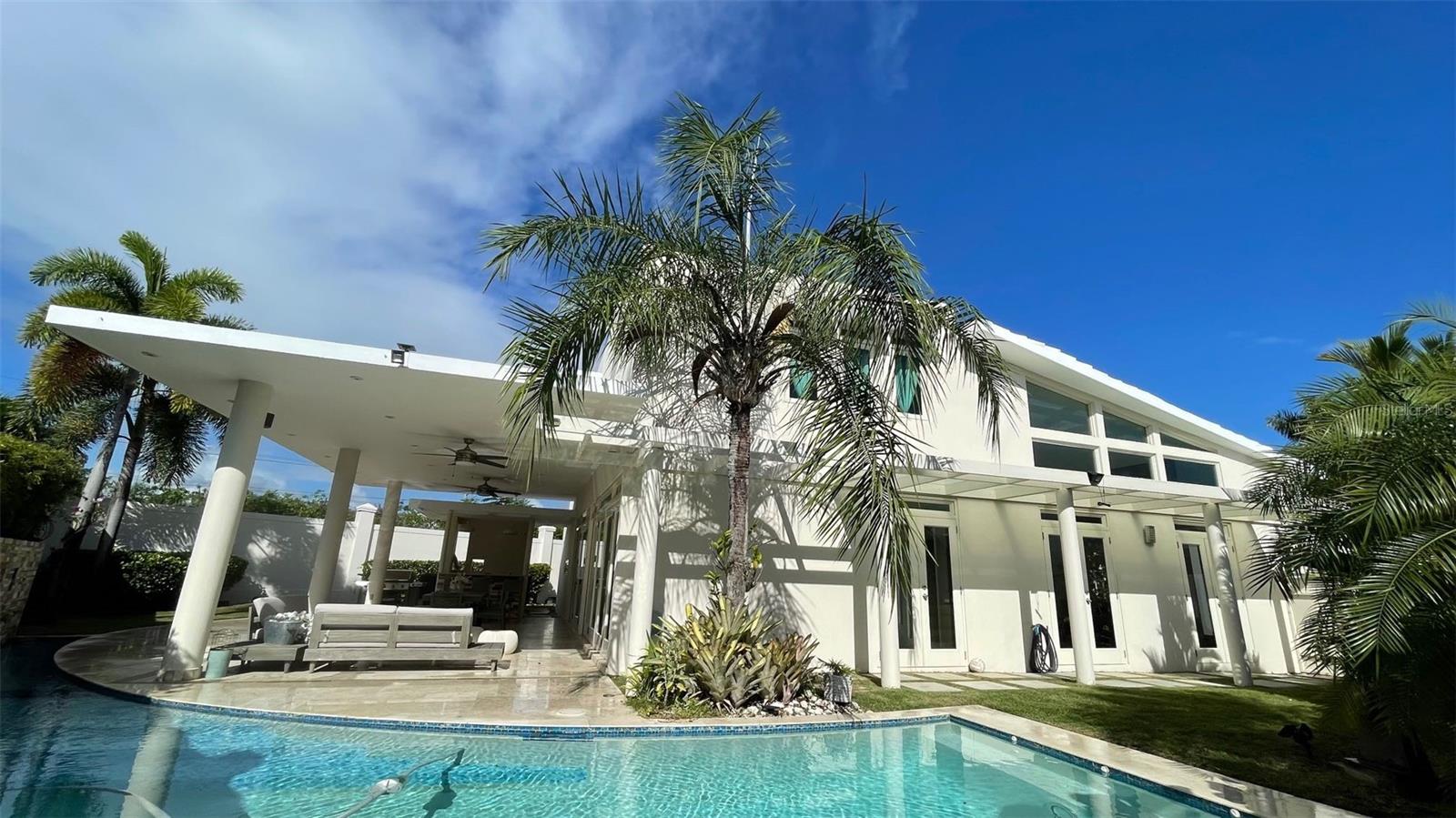 Luxury Home in Palma Real – Exclusive Gated Community in Guaynabo
Discover unparalleled luxury in Palma Real, one of Guaynabo’s most exclusive neighborhoods, offering a refined living experience in one of Puerto Rico’s top-rated cities.
Property Details:
Living Area & Lot Size: 3,359 ft² (construction) | 688 m² (lot)
Bedrooms: 4 + Maintenance Room with Private Bathroom
Bathrooms: 4 Full + 1 Half Bath
Living Spaces: Enclosed Family Room, Open-Concept Living Room, Dining Area & Kitchen
Outdoor Space: Expansive Terrace with a Pool – Ideal for Relaxation & Entertaining
Laundry Room: Conveniently Located on the Ground Floor
Premium Features:
? Solar Water Heater – Energy-efficient & eco-friendly
? Backup Generator – Ensures uninterrupted power supply
? Water Cistern – Reliable water storage for peace of mind
? Fully Equipped – Move-in ready with top-tier finishes
A luxueious Lifestyle in Palma Real
Nestled in Palma Real, this property offers the ultimate combination of privacy, security, and exclusivity, within a gated community known for its meticulously maintained surroundings and premium amenities. Enjoy the vibrant yet tranquil atmosphere of Guaynabo, consistently ranked as one of the best places to live in Puerto Rico, with top-rated schools, fine dining, and world-class shopping just minutes away.
HOA Fee: $330
Asking Price: $1,650,000
Experience luxury living at its finest in Palma Real. Schedule your private showing today!