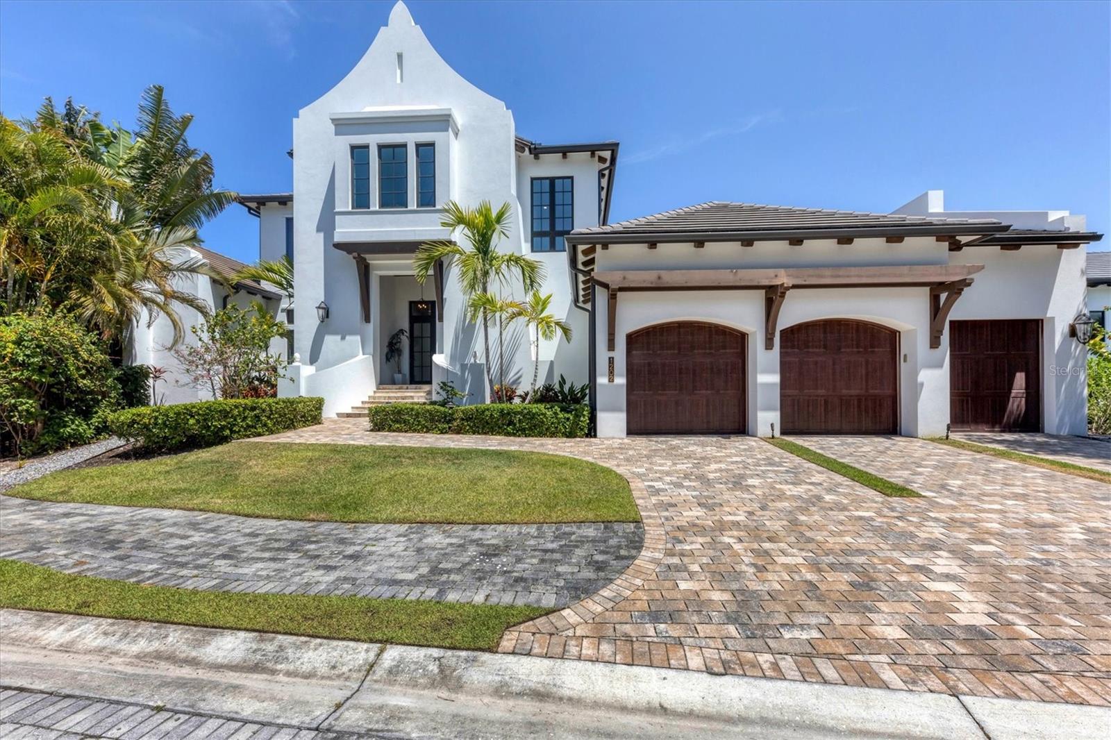 Annual, partially furnished single-family pool home is available for lease on Siesta Key. In the gated community of Spice Bay, this four-bedroom plus den London Bay home is 5,000 square feet of tasteful luxury. The small community of Spice Bay has a private dock on Sarasota Bay and the home comes with a 14,000-pound boat lift plus two floating jet ski docks. The home features a gourmet kitchen, butler’s pantry, double-sided wine refrigerator and top-end appliances. The outdoor kitchen and dining area have a retractable screen that opens up to the pool with sun deck, spa, waterfall and nearby fireplace. The location just south of Stickney Point Road allows for easy access to the mainland for all shopping, dining and entertainment Sarasota has to offer.