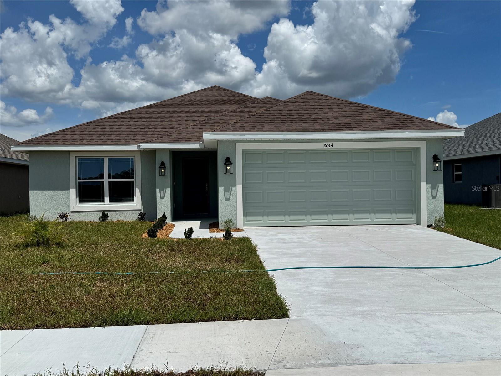 Under Construction. This new home in the gated community of Watercress Cove offers 3 bedrooms, 2 bathrooms, and 1,970 square feet of living space. Designed with an open floor plan, it features high ceilings and a spacious great room. The kitchen is equipped with Granite countertops, appliances, including a stove, microwave, and dishwasher. Porcelain tile flooring runs throughout the common areas, with cozy carpeting in the bedrooms. Conveniently located within a half-hour of our top Gulf beaches, this home provides easy access to shopping, schools, and more, all with the benefit of low HOA fees