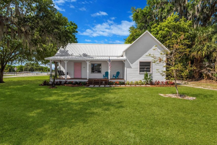 This is the picture-perfect old Florida cottage you’ve been searching for!  This thoughtfully updated home is nestled in the heart of historic downtown Fort Meade, offering a delightful blend of timeless charm and modern convenience. The bright and airy eat-in kitchen serves as the heart of the home, featuring generous cabinet space, a newer stainless steel refrigerator, and a natural gas stove—perfect for everything from quiet mornings to lively gatherings.  Both bedrooms are impressively sized at 14.5 x 14.5, creating comfortable retreats, and tons of closet space for added convenience. The updated bathroom offers a spacious feel, complete with an oversized shower designed for comfort. Sunlight pours into the inviting living room, where a natural gas fireplace adds warmth and character—an ideal setting to unwind at the end of the day. Updated ceiling fans with lighting add a fresh, stylish touch throughout the bedrooms and main living space.   Step through the newly installed storm door onto the welcoming front porch, where a classic swing invites you to relax and enjoy the gentle evening breeze. The front steps and porch decking were beautifully redone in 2025, enhancing the home’s curb appeal. Out back, a second porch offers even more versatility, complete with a half bath that could easily be transformed into a full bathroom, with plumbing already in place for a shower or tub. Set on nearly half an acre, the property offers plenty of space to enjoy the outdoors. The RV/boat pad doubles as a perfect spot for entertaining, grilling, or simply relaxing under wide-open, star-filled skies. Two sheds provide excellent storage, with one featuring electricity and a window AC unit—ideal for a workshop or creative space.  An additional shed is currently a super-cute chicken coop, or could be made into a garden shed or workshop.  Recent upgrades provide peace of mind, including updated plumbing throughout (2023), a new 2.5-ton AC and heating system (2025), and a water heater installed in 2018 with both electric and natural gas options.  Come experience the warmth, character, and possibilities this charming home has to offer—schedule your showing today.