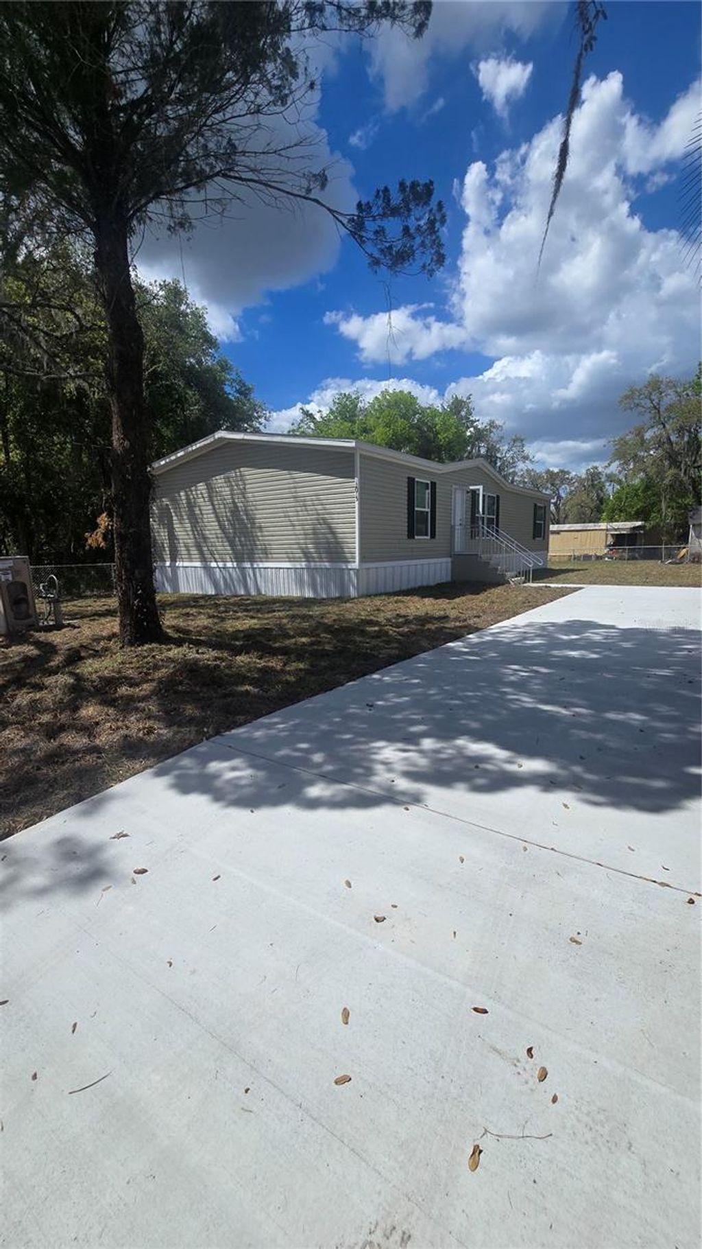 Photo of 12015 Westbay Avenue, New Port Richey, FL 34654 (MLS # TB8493271)