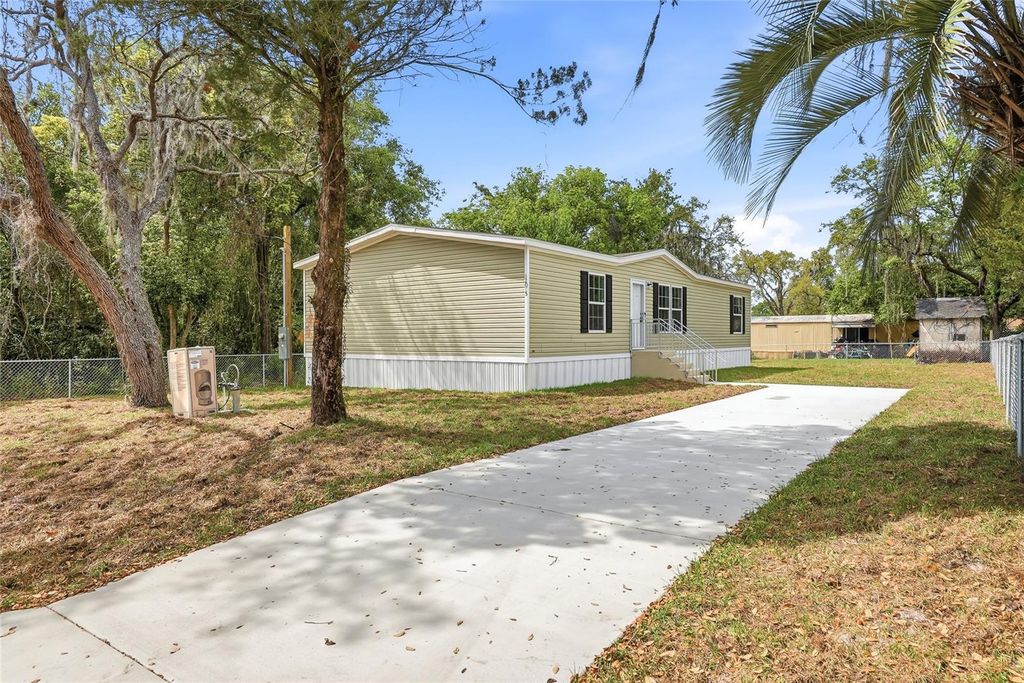 Photo of 12015 Westbay Avenue, New Port Richey, FL 34654 (MLS # TB8493271)