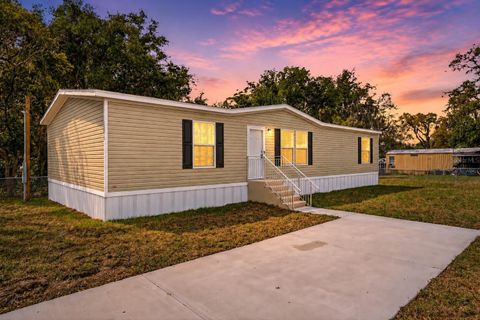 Photo of 12015 Westbay Avenue, New Port Richey, FL 34654 (MLS # TB8493271)
