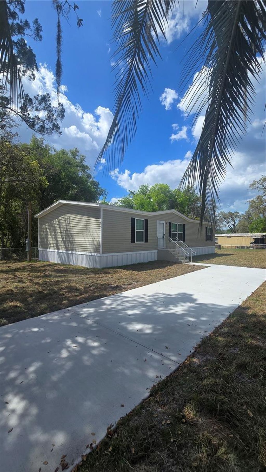 Photo of 12015 Westbay Avenue, New Port Richey, FL 34654 (MLS # TB8493271)
