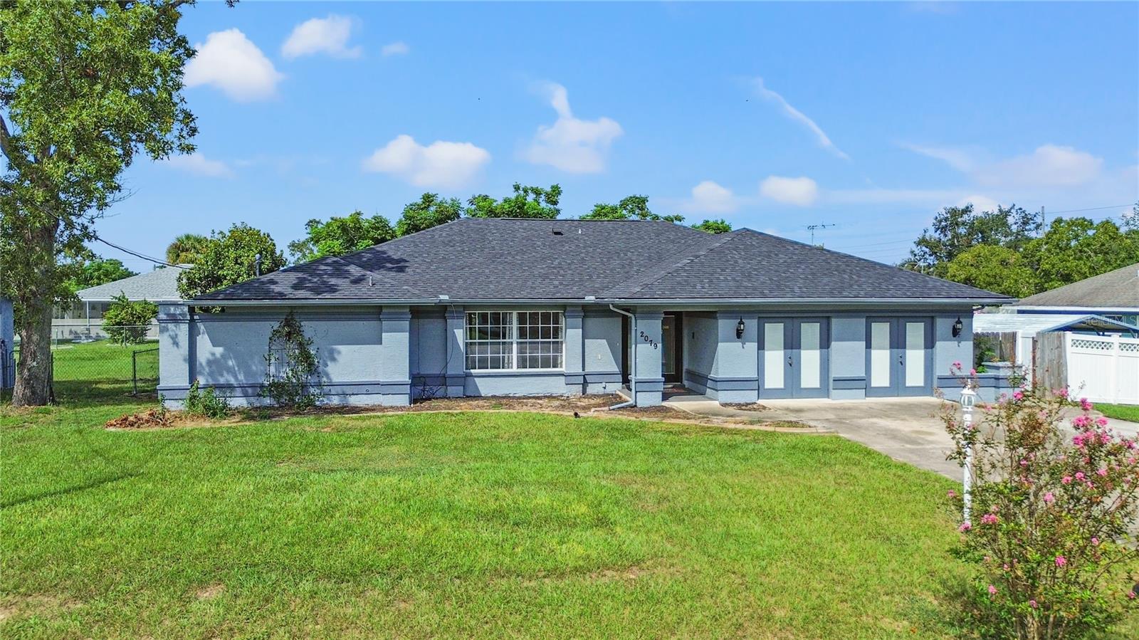 One or more photo(s) has been virtually staged. Investor Special with Endless Potential – No HOA or CDD! Welcome to this spacious 4-bedroom, 2-bath home offering over 2,700 sq. ft. of living space in the heart of Spring Hill. Bursting with potential, this property is perfect for investors, renovators, or buyers with a vision to transform it into their dream home. Inside, you’ll find a thoughtful layout with a living room, family room, formal dining room, and a converted garage providing additional space for flexible living. A cozy wood-burning fireplace adds charm, while the screened lanai invites you to relax and enjoy the outdoors. A brand-new roof has already been installed, giving you a head start on improvements. While the home needs cosmetic TLC, it has been listed under market value to accommodate the updates needed, making it an incredible opportunity for the right buyer. The property also offers peace of mind with no HOA or CDD fees, is located outside of a flood zone, and was previously used as an adult care center, providing unique potential for multi-use living. With its generous square footage and versatile floor plan, this home is ready for someone to breathe new life into it. With updates and personal touches, it can easily become a beautiful family residence, a profitable rental investment, or a specialty property. Bring your vision and see the incredible opportunity waiting!
