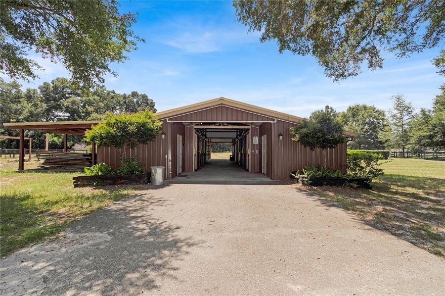 Great Equine Investment Property! Located within minutes of the Florida Horsepark and the Greenway Riding Trails. Explore the most popular
horseback riding trails in Marjorie Harris Carr Cross Florida Greenway. This is an incredible opportunity for anyone interested in equestrian
activities or income-producing properties! With 10 acres of land, 13 large stalls, plenty of turnout space, and additional amenities like RV
hookup, this horse offers both functionality and convenience. The Riders lounge has a full bath and kitchenette and extra rooms in the barns are great bonuses for added flexibility. It definitely is a unique and valuable property! Plenty of land to build a home on the property. Conveniently located near Ocala, Belleview and The Villages. 15 miles to World Equestrian Center. Needs some TLC!