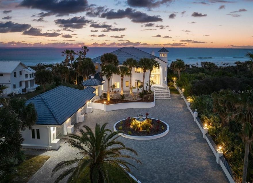 Unparalleled Oceanfront Luxury - A Gated Estate Like No Other! Step into a world of unrivaled elegance and breathtaking beauty with this incredible oceanfront estate. Nestled in a premier location just steps from the iconic Ponce Inlet Lighthouse and the serene Disappearing Island, this magnificent property offers an extraordinary blend of luxury, sophistication, and coastal charm. As you enter through the private gates, a stunning paver courtyard welcomes you to a residence that exudes grandeur at every turn. Inside, superb design and stellar architecture set the stage for an unforgettable living experience. The home boasts over 7,500 sq. ft. of meticulously designed living space, featuring 5 spacious bedrooms, 5 beautifully updated baths, and 1 half bath. From the moment you step inside, exquisite details captivate the eye - from grand coffered ceilings and marble floors throughout the main living areas to new impact windows, custom railings, and impressive light fixtures. The extensive use of travertine enhances the estate's luxurious ambiance, placing it in a league of its own. Breathtaking Views & Exceptional Features such as panoramic ocean views greet you from nearly every room, allowing you to wake up to the sound of waves crashing and stunning sunrises. A staircase leads to a majestic turret, offering unparalleled 360-degree views as far as the eye can see. A full basement theater with a wet bar and full bath provides the perfect space for entertaining in style. The galley-style chef's kitchen is a dream, featuring a wet bar, massive center island, breakfast bar, and eat-in area overlooking the ocean. The travertine and marble fireplace serves as a statement piece in the grand living area, adding warmth and elegance. The second story is home to an opulent primary suite, complete with a private sitting area, spa-like master bath, and a sprawling travertine balcony where you can start your mornings with a cup of coffee and the soothing sight of the surf. Seamlessly blending indoor and outdoor living, this estate offers commanding ocean views through walls of glass, leading to expansive outdoor spaces designed for relaxation and entertainment. Enjoy the saltwater black-finished pool and patio areas, where smiling weather invites you to unwind and soak up the coastal breeze. With a private walkway through the dunes, the beach is quite literally your backyard-your slice of paradise awaits! Don't miss this once-in-a-lifetime opportunity to own a prestigious oceanfront estate that defines coastal luxury living! Schedule your private tour today!
Square footage received from tax rolls. All information recorded in the MLS intended to be accurate but cannot be guaranteed.