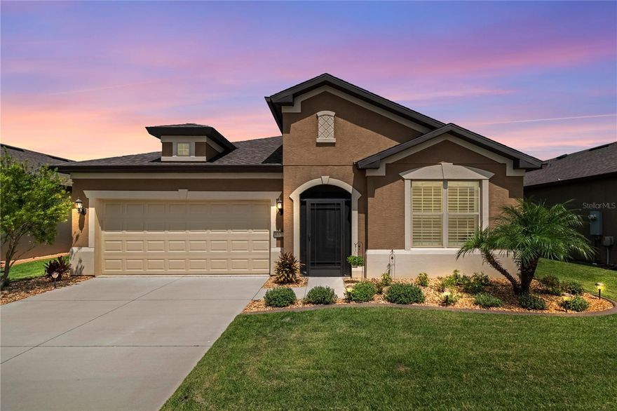 This stunning, newly renovated home is located in the sought-after 55+ guard-gated community of Stone Creek with resort style amenities of pools, a health spa, fitness center, ball courts, lakes, dog parks, and entertainment. Great golfing is also available at the Stone Creek Golf Club. This gorgeous home has a modern farmhouse design style with earthy textures combined with classic finishes. Once you step inside you will see and feel the difference. The light and bright, open concept floor plan with split bedrooms and a large muti-purpose flex room offers the charm and casual openness that will make your family and friends feel right at home. The newly renovated kitchen features light cabinets, beautifully veined premium quartz countertops, open shelving, a new high-end Z-Line range hood, Bedrosians Cloe tile backsplash and a large single basin SS sink with commercial style faucet and SS appliances. Custom carpentry on the island and cabinets add to the enhanced design. The lower cabinets have pull-out drawers for convenience and there is plenty of storage in the large pantry. You will then fall further in love as both bathrooms have been completely renovated and upgraded to today’s standards. They feature custom tile designs and beautiful fixtures, faucets, mirrors, and lighting. Plantation shutters are throughout the home. Luxury Vinyl Plank (LVP) flooring throughout the home with NO CARPET. The new light interior paint, ceiling fans, lighting, a custom stop and drop with a built-in bench/storage and shiplap walls complete the package of “Bye, Bye Boring Builder Beige/Grade”.  The light and bright finishes create a timeless and classic environment that you will be proud of for years to come. The extended screened backyard lanai is quiet and private with mature plantings and flowers. The extra-large two car garage is complete with an epoxy garage floor. Fantastic location within a short distance to all the great amenities that Stone Creek has to offer. This fabulous home is located within 8 miles of the unparalleled World Equestrian Center and the new Shoppes Off 80th (coming soon in 2025), an 80,000-square-foot outdoor shopping venue offering a swath of unique storefronts featuring luxury brands, all in one convenient location.  All the hard work has been done on this home just in time for you to move in and enjoy life. WELCOME HOME!