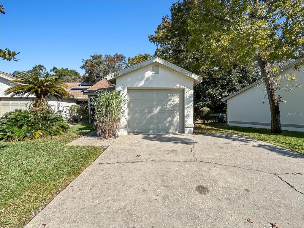 Photo of 11746 Spring Tree Lane, Port Richey, FL 34668 (MLS # O6360619)