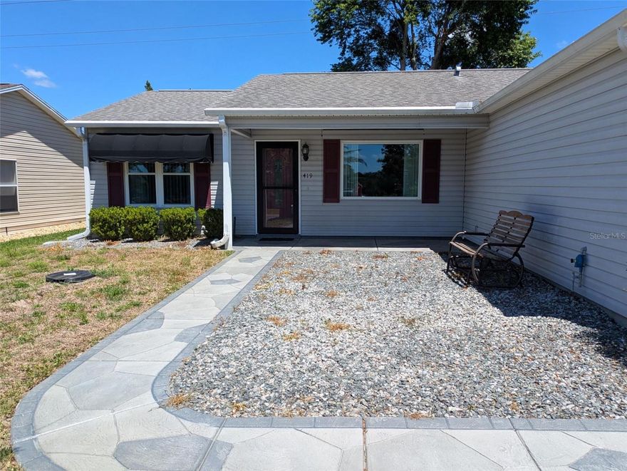 Move-in ready with all the extras; whole house generator with 250 gal buried tank, updated kitchen with granite countertops, luxury vinyl plank flooring, newly painted, roof 2015, ac 2020, sanitized and redone duct system and a lovely green view out the back with no neighbors.  Drive up the gorgeous stamped concrete driveway.  Walk into the open living area with with luxury vinyl plank flooring. The split bedroom plan gives privacy.  The updated primary bath has large beautiful shower and the bedroom has a large walk-in closet. Open kitchen has tons of counter space to work.  Lanai looks out to open green space.  Pristine Yamaha golf cart ready to drive around.  Epoxy floor in garage with a chest freezer and a laundry tub.  Convenient location off of Morse.  No Bond.