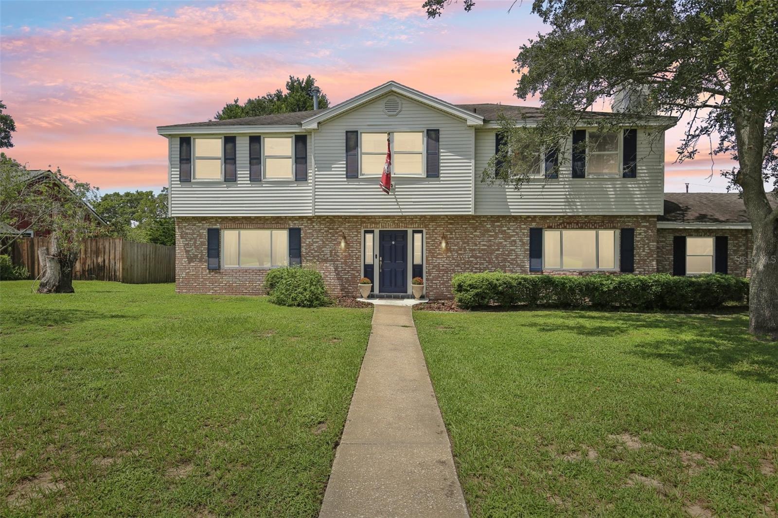 Welcome home to this charming Brandon gem with OPTIONAL HOA and NO CDD! Sitting on a HALF ACRE with a POOL, this STATELY home is surrounded by mature trees, giving you that peaceful “Florida living” feel while still being close to everything. Plus enjoy peace of mind with a NEW ROOF and A/C at closing!
Step inside to a bright, inviting layout with NEWER WINDOWS and a full remodel down to the studs. Natural light pours through the living and dining spaces, creating a seamless flow that’s perfect for everyday living or entertaining. The kitchen is truly a CHEF’S DREAM featuring a double oven, pot filler over the cooktop, a HUGE island with granite countertops, and an oversized walk-in pantry with a custom barn door. Just off the kitchen, discover the bonus room which is currently used as a 6th bedroom, but also ideal for an office, craft space, or even a mudroom.
Upstairs, the Primary Suite offers its own ensuite bath, while down the hall you’ll find four additional generously sized bedrooms with original hardwood floors. This upper level is full of charm and ready for your personal touch.
The backyard is your private retreat. Swim in the sparkling pool, grill out with friends, or simply relax under the shade. An oversized driveway, attached garage, and extra storage mean you’ll have plenty of space for all your toys, too!
Centrally located in Brandon, you’re just minutes from shopping, dining, schools, and quick access to I-75 and the Crosstown. This home has been lovingly cared for and is ready for its next owner to move right in and enjoy!