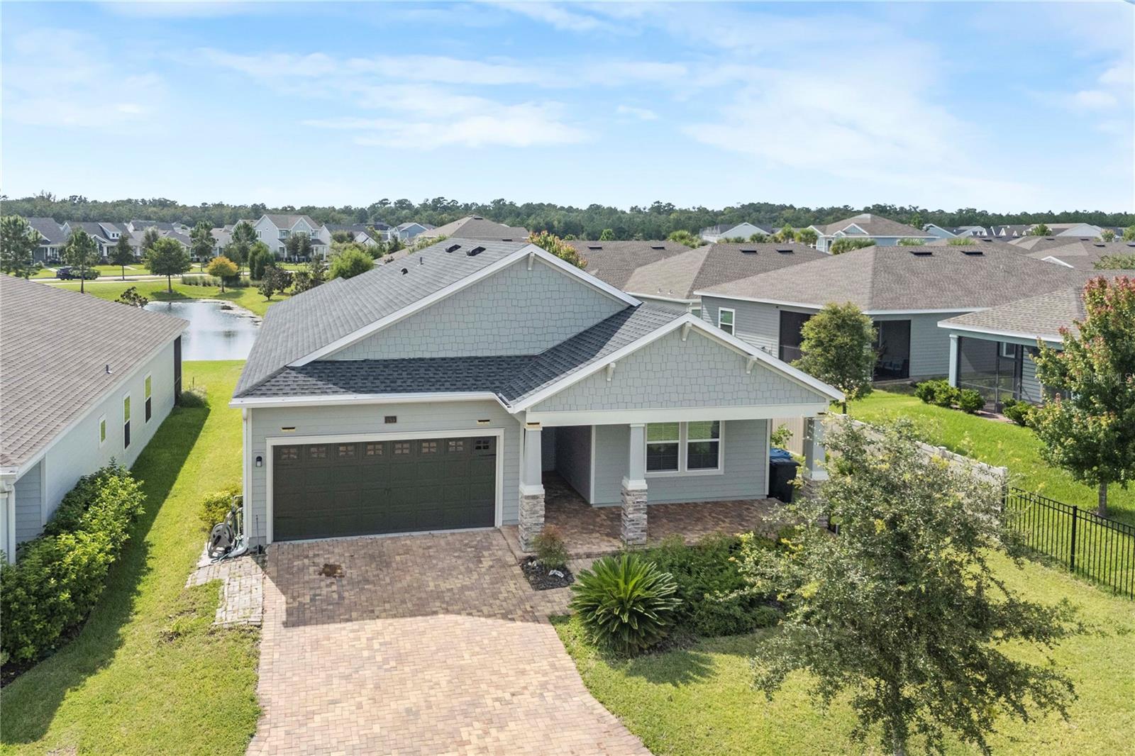One or more photo(s) has been virtually staged. Welcome to this stunning 4-bedroom, 2 bath home with a private office, built in 2022 and perfectly situated on a desirable waterview corner lot in the highly sought-after Shearwater community of St. Augustine. Offering both style and function, this residence combines modern design with everyday comfort. From the moment you arrive, you’ll notice the beautiful curb appeal and tranquil waterviews, all enhanced by HOA-maintained landscaping that keeps the surroundings lush and low-maintenance. Step inside to a bright, open floor plan where the living room, dining area, and kitchen flow effortlessly together perfect for hosting or relaxing with family. The kitchen is a true highlight, featuring stainless steel appliances, abundant storage, and gas stove. The spacious primary suite offers a peaceful retreat, complete with a spa-inspired bath including dual sinks, a soaking tub, and separate shower. Additional touches throughout the home include a tankless water heater and enhanced laundry room storage. Life in Shearwater is designed for those who love to stay active and connected. Residents enjoy resort-style amenities such as a lazy river, lagoon-style pool, three-story waterslide, and dedicated lap pool. The fitness center offers everything from weight training to yoga, while tennis enthusiasts can play on four clay courts, including one with stadium seating. Kayak access to Trout Creek and over 15 miles of scenic trails add even more opportunities for outdoor fun. Families will appreciate access to top-rated St. Johns County schools, including Trout Creek Academy (K–8) and Beachside High School. With convenient access to both Jacksonville and historic downtown St. Augustine, plus plenty of shopping and dining nearby, this home offers the perfect balance of comfort, community, and location.