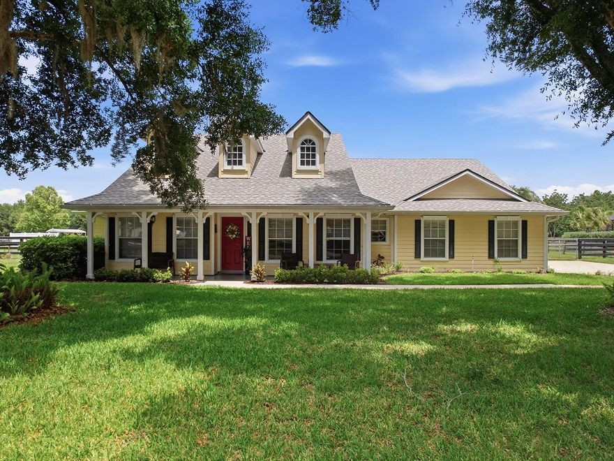 GORGEOUS "MOVE-IN READY" 4-BEDROOM, 3-BATH, 1-ACRE W/OVER $125,000.00 ADDITION/REMODEL IN LAURELS, MOUNT DORA, FL 32757. Experience the perfect blend of peaceful country living & everyday convenience with this beautifully updated 4-Bed, 3-Full Bath home situated on over 1 acre & just a short 10-minute drive to downtown Mt, Dora’s shops, dining, and entertainment. With over $125,000+ of Upgrades & Improvements completed in 2024/2025, this thoughtfully expanded home includes a brand-new addition featuring an added Full Bedroom & Full Bath, creating a spacious & functional split floor plan ideal for families or Multi-Generational Living. As you enter the large Foyer, you'll be Wowed by the 17' high entry ceiling & access the Formal Dining Room with a Custom Ceiling & Functional Dormers. Proceed into the large Family Room which centers around a cozy, Real Wood Burning Fireplace w/Wood Mantle & Decorative Shiplap & Tile Finishes, plus a Vaulted Ceiling, Custom Built-ins, Planter Shelves, Wall Niche, Surround Sound Speakers & Wiring, Ceiling Fan/Light, and French Door access to the rear porch. The Kitchen is designed to impress with 42” Wood Cabinets featuring Upper & Lower Crown Molding, Onyx Granite Counters, Custom Tile Backsplash, Stainless Appliance Package including Double Ovens, Flat-Top Range, French Style Refrigerator & Microwave. Additional highlights include a Double Stainless Sink with Gooseneck Faucet, Breakfast Bar Seating for four, Butler, Tons of Counter & Storage Space, Closet pantry, Recessed Lighting, Planter Shelves, and an 8'x9' Dinette overlooking the backyard. The Primary Suite is the perfect Couples Retreat, complete with a Large Bedroom that will accommodate all of your oversized furniture comfortably, Bay Window, French Door access to Patio, and complete with a large walk-in closet for all your wardrobe needs. The Primary Bathroom was gutted & fully remodeled in 2025 as a Spa-Inspired Bathroom showcasing a His/her Hepburn Designer Wood Vanity with Double Recessed Sinks & Quartz Countertops, a Freestanding 59" Acrylic Soaking Tub, a Stunning Walk-in Shower with Pebble Beach natural Marble Mosaic Flooring, Custom Ikon Glacier Porcelain Wall Tile, Frameless Glass Enclosure, Glass Block Window (Faux), Closet Storage, Custom 12"x24" Floor Tile and updated hardware & fixtures. Step outside and enjoy true Florida outdoor living. The welcoming 5'x29' Covered Front Porch is perfect for morning coffee or evening relaxation. Out back, you’ll find a 10'x17' Covered Paver Patio along with a 13'x25' Open Patio, both ideal for entertaining. The fully "Ranch Style" fenced property is shaded by mature oak trees and includes a 12'x20' Storage Shed, 8'x10' Playhouse w/Slide, Dedicated Fire Pit area for gathering with friends and family. Owners are allowed to park anything in the backyard. Additional features: Newer Roof (2018), HVAC Handler/Compressor (2022), Septic Drain field (2023), Newer Laminate Flooring, (3) "Real" Dormers with Custom Ceilings for tons of natural lighting, Triple Split Floor Plan, Inside Laundry Room, In-Wall Pest Control System, Well & Septic, Water Softener, Gutters & Downspouts, 40-Gallon Water Heater, Lush St. Augustine sod throughout and more. This home is truly Move-In Ready and offers Exceptional Value. If you’re looking for space, privacy, and modern upgrades without sacrificing proximity to city conveniences, this property delivers the best of both worlds.
