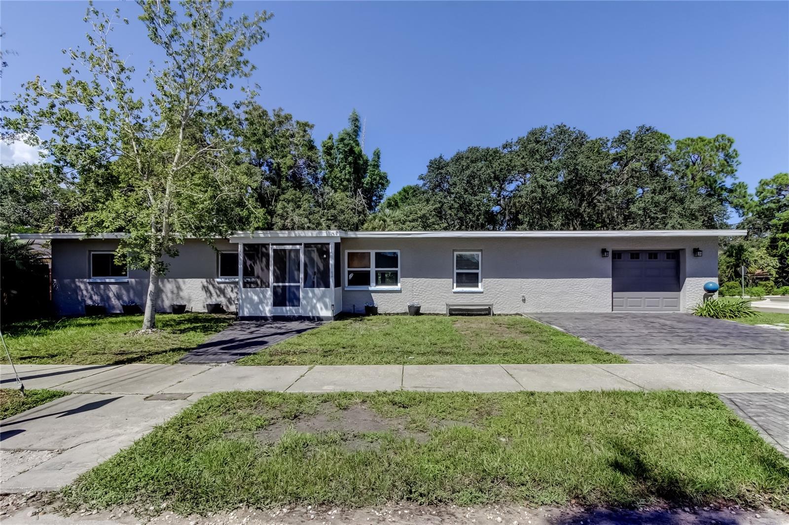 What a stunning home and the location in DOWNTOWN SAFETY HARBOR is superb! You can WALK TO MAIN STREET IN JUST 3 MINUTES! This excellent floor plan has 4 bedrooms and 2 bathrooms. There is NO CARPET, JUST BEAUTIFUL LUXURY VINYL FLOORING. You can make a PRIVATE MASTER SUITE retreat on one side of the house. There is a bedroom and additional room for an office, work out room or private sitting area. The shower is handicap accessible with a zero entry. The kitchen is gorgeous with a GAS STOVE, fabulous granite, and an abundance of cabinet and storage space. You can have countertop seating or use the table and chairs that are provided. How about the yard, wow! It's a BACKYARD OASIS WITH ALMOST A QUARTER OF AN ACRE, FENCED IN, STORAGE CLOSET AND A RELAXING SEATING AREA. THE OUTDOOR FURNITURE WILL STAY WITH THE HOUSE. There is a kitchenette in the garage as well as lots of storage and ROOM TO PARK A CAR. Don't forget about third Friday, fabulous restaurants, shoppings, spa, fun bars, library, Philippe Park and the rec center. Enjoy all that Safety Harbor has to offer in this centrally located, well appointed home. All occupants over 18 years of age must apply.