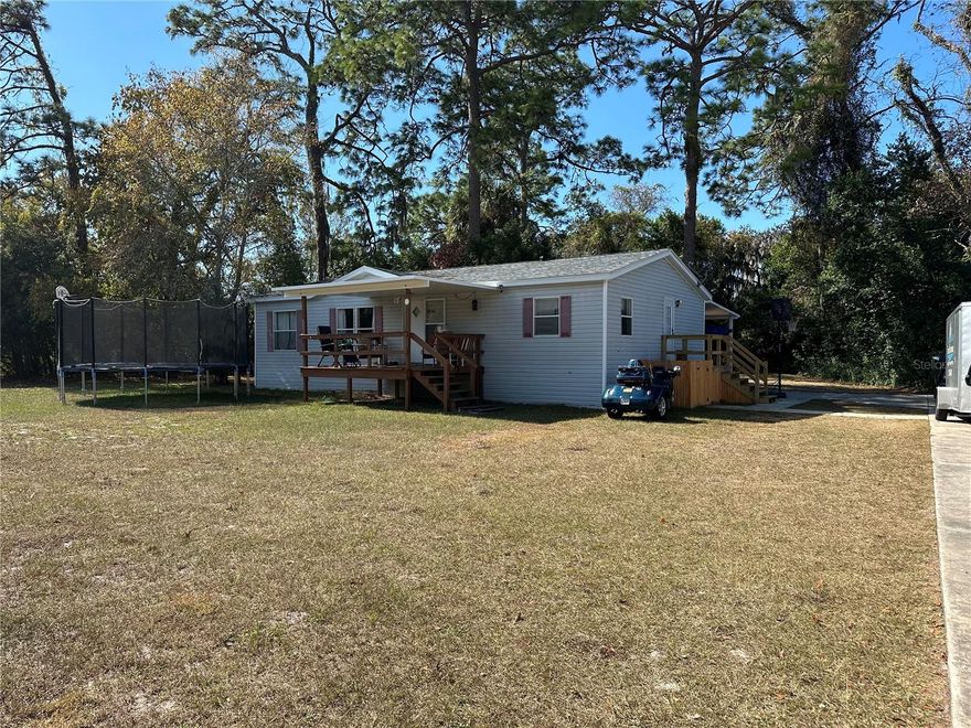 Must See!!! This move in ready home located on a very private fenced-in 1/2 Acre lot. This is a turn key property, move right in, many updates including kitchen and baths, flooring appliances, plumbing and electrical. Large master suite with shower and tub, inside laundry, plenty of storage. Kitchen has breakfast bar, large island as well as work/desk area. This lot has plenty of privacy with a fence all around as well as mature landscape in the back. Plenty of concreted parking space, as well as a 2 car carport.