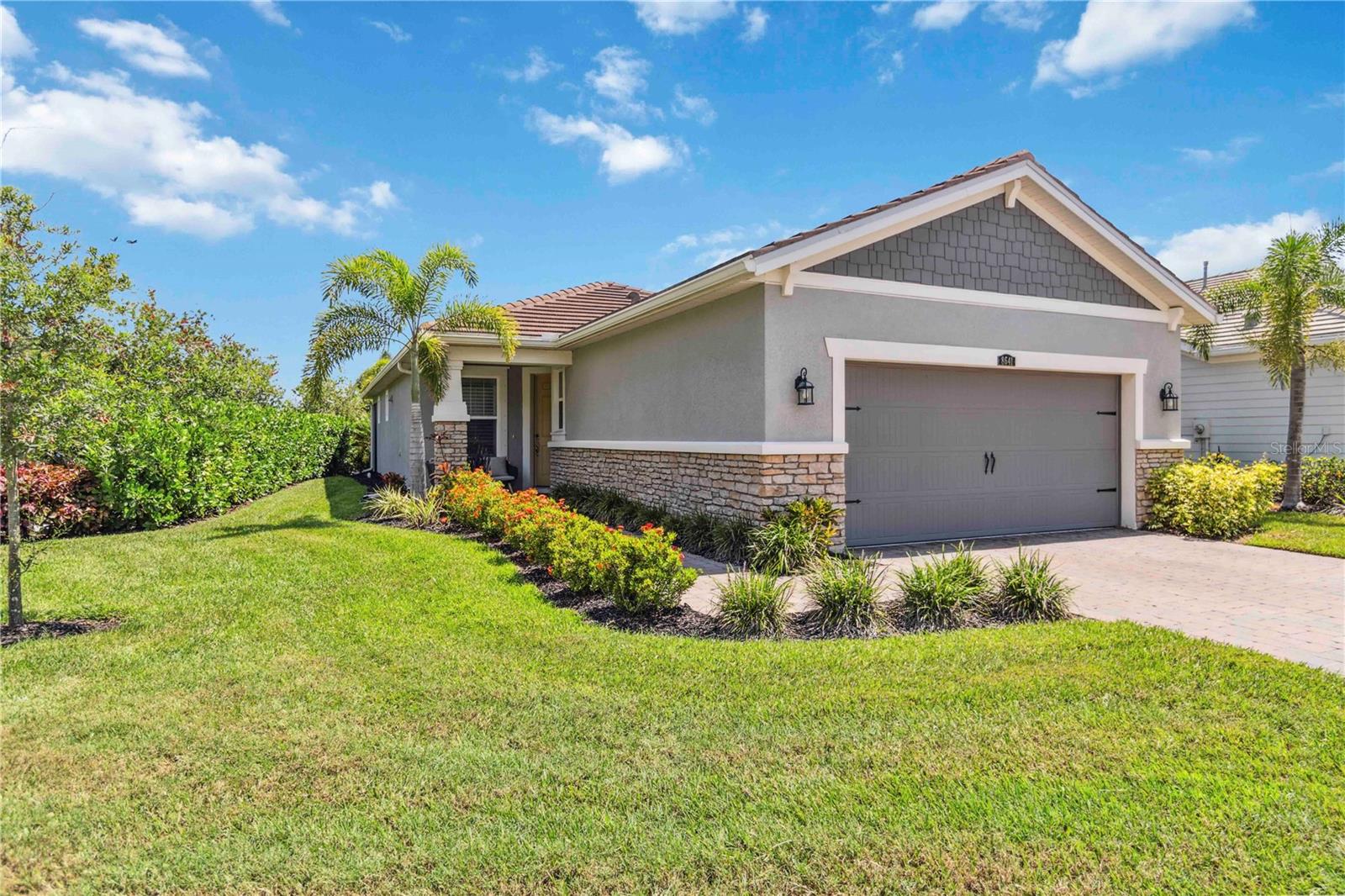 Come discover Sarasota, the jewel of the west coast of Florida minutes to its tropical blue gulf waters, world famous soft sandy beaches, and vibrant downtown cultural center. Sunrise Preserve at Palmer Ranch is a gated life-style community built new 2021 with easy access to I-75 . It has all the amenities you are looking for, pickleball, tennis, clubhouse, fitness gym, an activities director, and large resort-style pool w/lap lanes and beach entry. Your home is landscape and exterior maintenance free, built new 2021 in a light Florida Coastal theme with 2-bedrooms, front den, two baths, screened lanai, and 2-car garage. Your island kitchen opens to the great room and dining room for carefree living. A natural gas community, light linen colored shaker style 42” cabinets, 3cm quartz countertops w/ glass backsplash, stainless-steel appliances, GE refrigerator, Whirlpool: five burner natural gas range, microwave, and dish washer. Split floor plan design for privacy with designer 12” x 24” floor tiles in all the active living areas, tall ceilings w/ stepped ceiling details, and 8’ tall interior doors. Your corner homesite offers a side yard, paver drive with walkway to front porch and your back screened lanai on a paver deck. Storm protection w/ underground utilities, natural gas and hurricane shutters.
