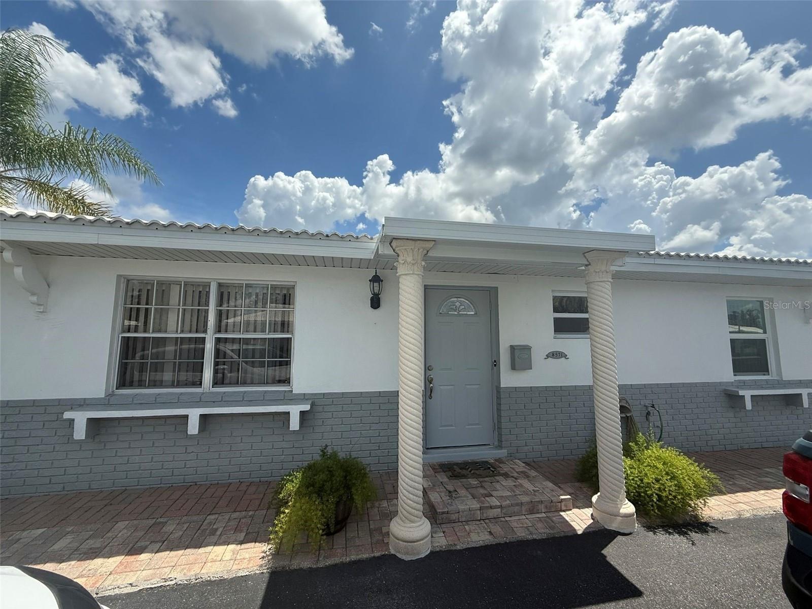 This home can be rented furnished or unfurnished. Charming 2 bedroom, 1 bathroom villa, with a carport with a Florida room in a 55+ community. The Florida room features an insulated roof and a ceiling fan. Granite countertops and stainless steel appliances, laundry room with washer & dryer, carport w/ pavers. Gorgeous landscaping all around the property which is maintained by the HOA. New impact windows on most windows. This won't last long schedule your showing appointment today.
