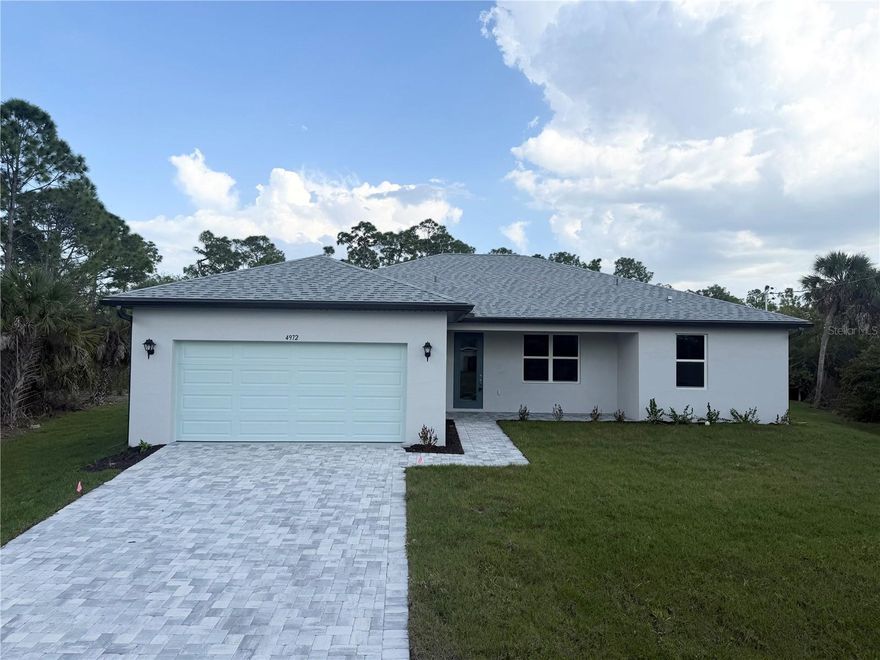 Some photos were used from previously built same model home. Welcome to Your Brand New Waterfront Dream Home on oversized 16,390 Sq.Ft. lot! Discover this stunning new construction 3-bedroom, 2-bathroom home perfectly situated on a freshwater canal in a prime North Port location, just minutes from Port Charlotte. Enjoy peaceful water views, a large backyard for fishing or outdoor entertaining, and a lifestyle that blends comfort, luxury, and convenience. Step inside and experience a bright, open-concept floor plan filled with natural light and modern finishes — ideal for both relaxing and hosting. The kitchen showcases beautiful Manta quartz countertops, a stylish breakfast bar, and modern cabinetry. The spacious living room features elegant ceramic tile flooring throughout, creating a cohesive and inviting space. Retreat to your luxurious bathrooms with custom tile work, quartz countertops, and walk-in tiled showers. Every detail of this home has been thoughtfully crafted, including hurricane-impact windows and doors, an epoxy-finished garage floor, WHOLE HOUSE RO SYSTEM, a huge lanai, and a laundry room with a utility sink and extra cabinetry. Located close to US-41, I-75, Warm Mineral Springs, CoolToday Park, Wellen Park, shopping, dining, and area beaches, this home offers the perfect combination of tranquility and accessibility. Don’t miss your chance to own this beautiful waterfront home — schedule your private showing today!