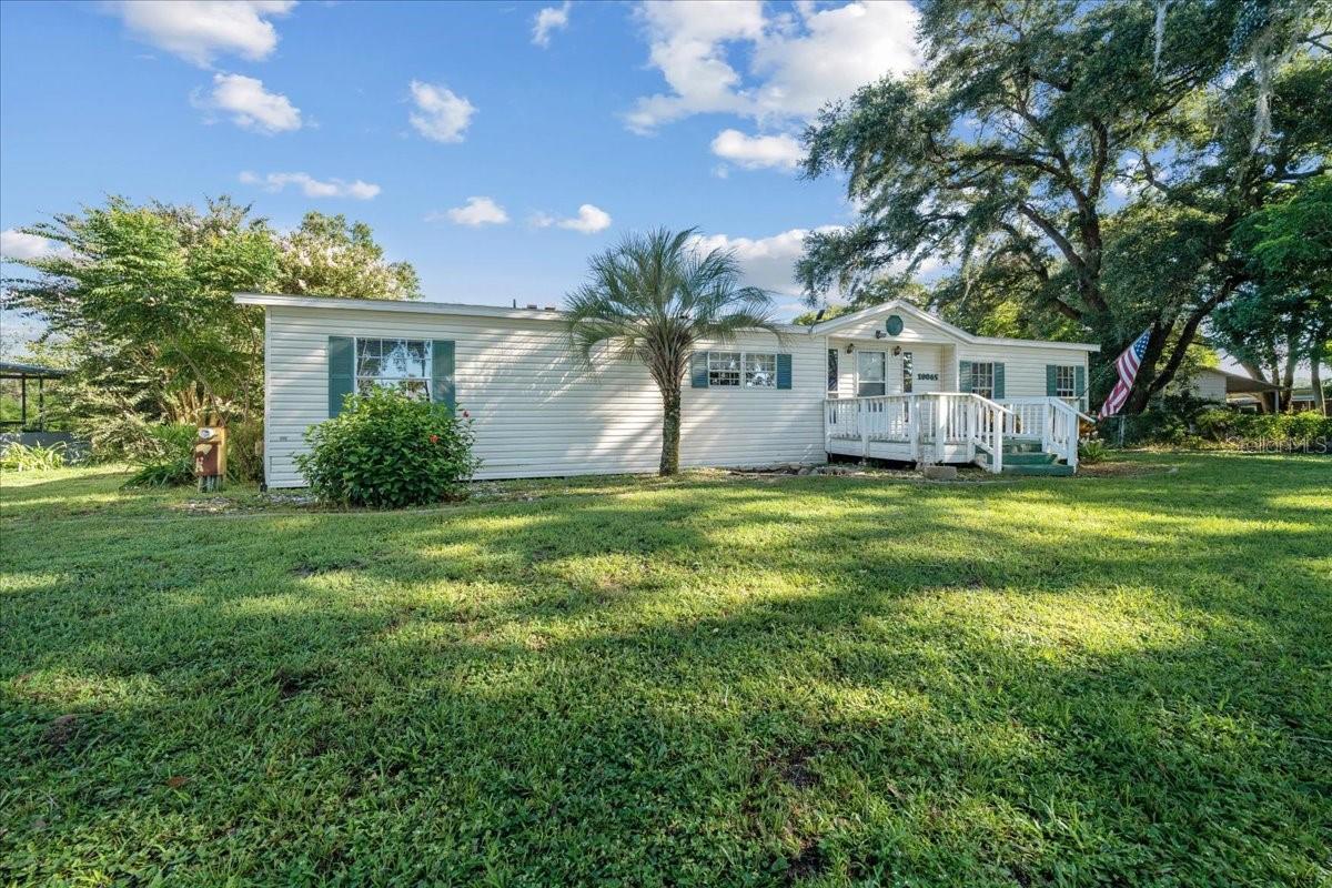 Private Retreat on Bird Island – 3/2 with Modern Updates & Room to Breathe
Tucked away on nearly half an acre in the quiet Bird Island area of Summerfield, this 3-bedroom, 2-bath mobile home offers the perfect mix of comfort, space, and privacy. Step inside to find updated luxury vinyl plank flooring, ceiling fans throughout, and a wood-burning fireplace that adds warmth and character to the living area.
The split floor plan provides functional space for both living and entertaining, while the separate laundry room keeps things tidy and convenient. Step out back to your covered porch, where you’ll enjoy peaceful views and a secluded setting — no rear neighbors, just nature.
With a newer roof (2021) and a generous lot size, this home is move-in ready with room to grow, garden, or simply enjoy the quiet. Whether you're looking for a full-time residence or a weekend getaway, this property delivers laid-back Florida living at its best.