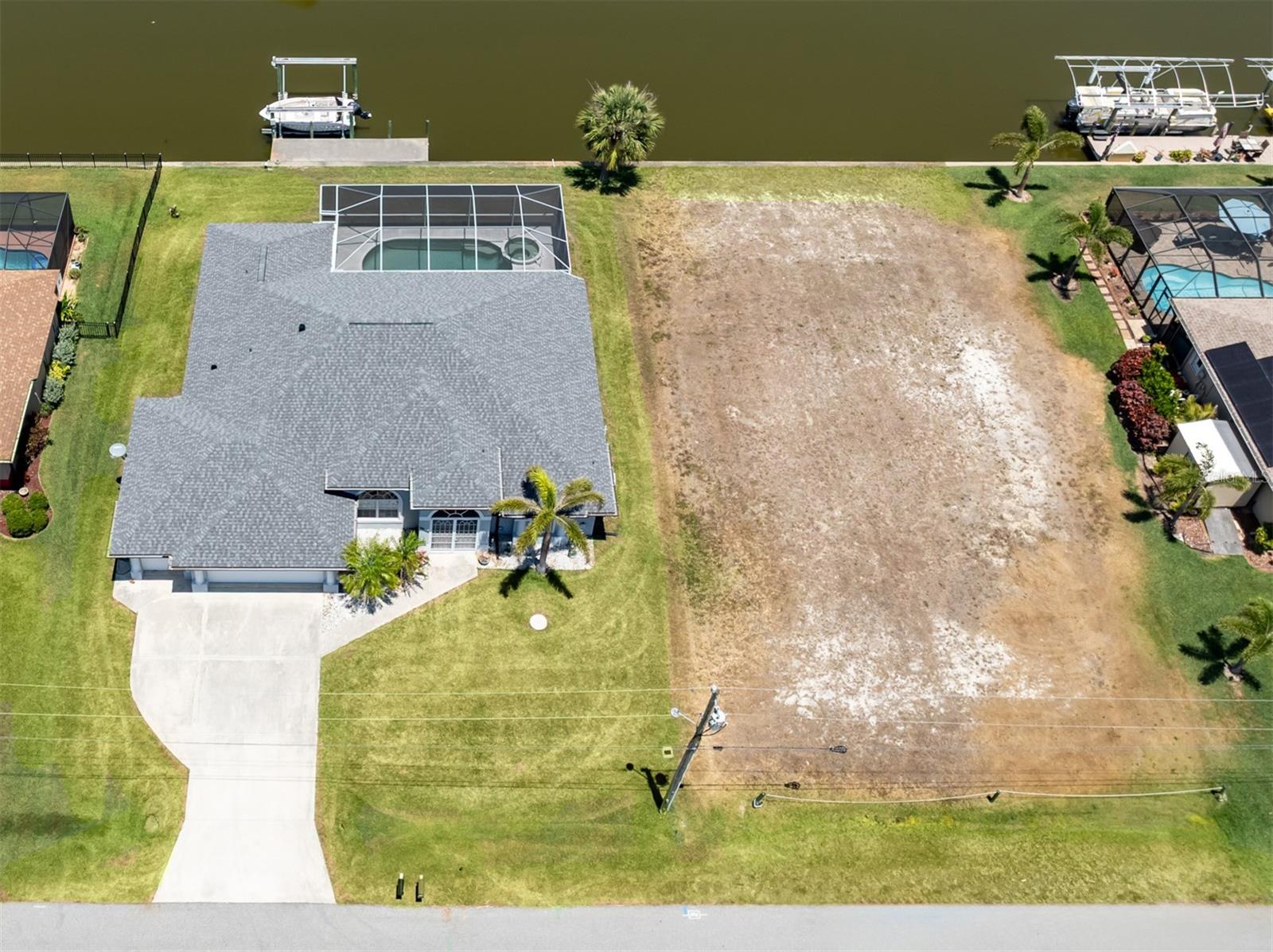 Build your dream waterfront retreat on this cleared, buildable canal-front lot with a sturdy seawall in place. The hard work is done! The home next door is also available for purchase from the same owner (MLS # N6138677). Buy just the lot and create your custom vision, purchase the home alone and enjoy a ready-to-move-in space or acquire both for an expansive property with endless potential. Whether you’re ready to build now or planning for the future, this lot is a rare find with optional neighboring property for those seeking extra space or investment versatility.