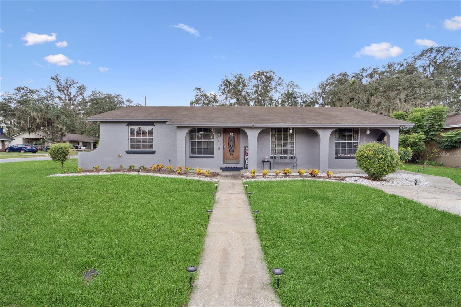 Welcome to your new home on a fantastic, fenced corner lot! This beautifully renovated single-family residence offers a spacious and functional layout, perfect for modern living. With 2,200 square feet, this home features 3 generously-sized bedrooms and 2.5 bathrooms, providing ample space for your family.
Step inside and discover a cozy living room that flows seamlessly into a massive 28x14 ft bonus room, offering endless possibilities for entertaining, a home gym, or a play area. The kitchen boasts solid wood cabinets and is ready for your personal touch. A wood-burning fireplace in the family room creates a warm and inviting atmosphere on cooler evenings.
The property also includes a valuable detached two-car garage with a built-in office/workshop and a convenient half bath, making it an ideal space for remote work, hobbies, or a potential in-law suite. Enjoy the Florida lifestyle from the large screened-in porch, perfect for relaxing and enjoying your private yard.
This home is situated in a great area with no HOA, offering you the freedom you desire. With a newer AC system and recent renovations throughout, this home is ready for you to move in and start making memories.