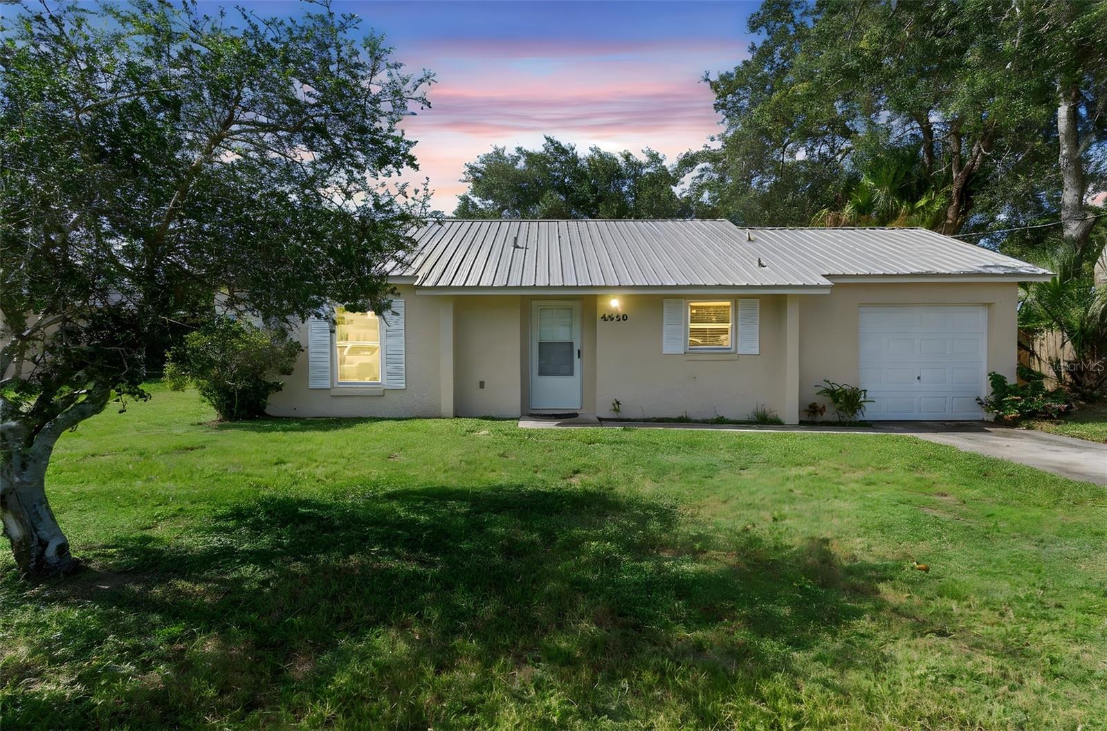 Charming and move-in ready 2-bedroom, 1-bath home featuring a "New Metal Roof" and numerous recent updates throughout. Enjoy peace of mind with a 1-year-old water heater, well-maintained plumbing and electrical systems (including replaced septic pipes), and updated windows, doors, AC, and flooring. The interior boasts durable wood-look vinyl flooring with tile in the bathroom. The kitchen has been refreshed with repainted wood cabinets, a metal sink with a new faucet, and a stylish new backsplash. Freshly painted inside with no cosmetic work needed—this home is ready for you!