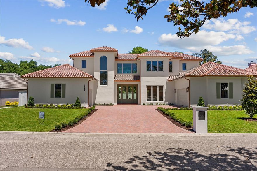 Welcome to an elevated standard of living. A distinguished Parade of Homes 2026 nominee, this exceptional custom estate at 7958 South Park Place in Orlando blends modern luxury, thoughtful design, and enduring craftsmanship.

From the moment you arrive, the home sets a tone of quiet prestige, where expansive architecture and carefully curated spaces create a private retreat designed for both grand entertaining and everyday comfort. Spanning nearly 5,000 square feet, every detail reflects a commitment to elegance without compromise.

The main level is filled with natural light, highlighted by soaring ceilings, oversized windows, and exquisite travertine flooring that flows throughout the open concept living spaces. Privately positioned on the first floor, the primary suite offers a true sanctuary with a spa inspired bath featuring dual showers and separate his and hers spaces.

At the heart of the home, the chef’s kitchen is both functional and striking, appointed with premium Sub Zero appliances, an oversized island, and a fully integrated wine and coffee bar. Adjacent living and dining areas create an effortless setting for intimate gatherings or large scale entertaining.

Upstairs, additional bedrooms and a versatile loft provide ideal flexibility for guests, recreation, or private workspace. Three thoughtfully designed laundry areas, including a dedicated primary suite laundry, an upstairs laundry, and a main laundry room with a custom pet washing station, bring exceptional convenience to daily living.

Outdoor spaces are equally impressive. The expansive screened lanai features a summer kitchen and fireplace designed for year round entertaining, while a private terrace off the primary suite offers a peaceful setting for morning coffee or evening relaxation.

Beyond its beauty, this residence was engineered for long term comfort and peace of mind. Advanced insulated concrete construction, high performance systems, solar energy integration, and backup power infrastructure deliver a rare combination of efficiency, sustainability, and storm resilience.

This is more than a home. It is a statement of craftsmanship, innovation, and a life exceptionally well lived.