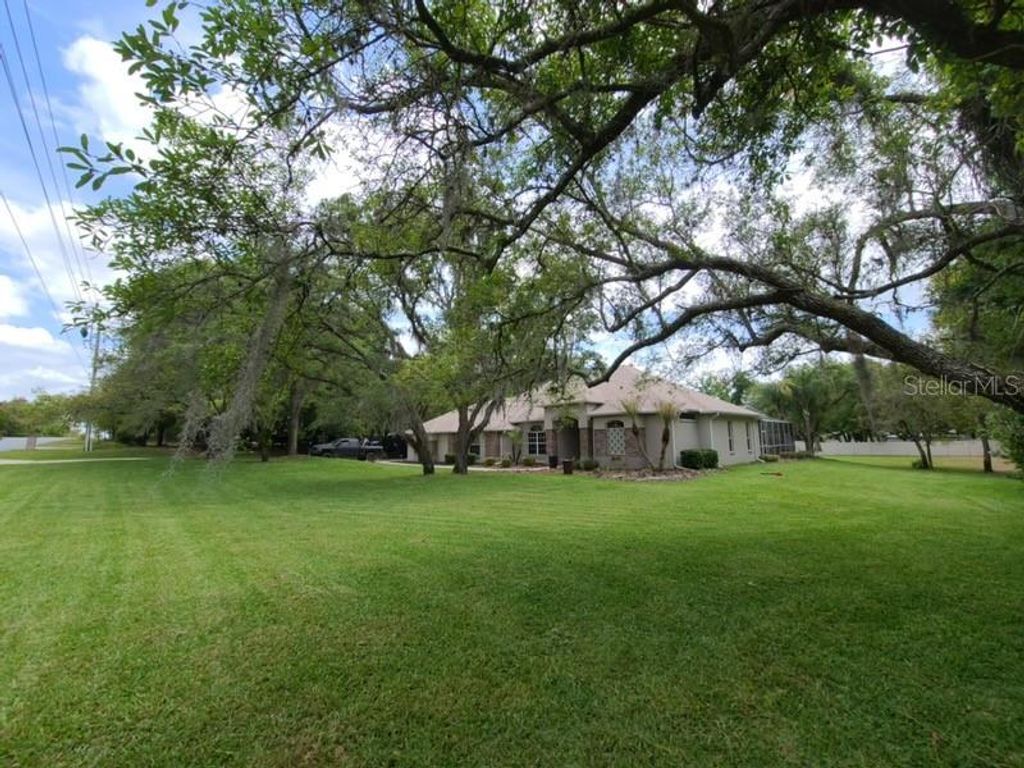 Photo of 13624 Cooper Road, Spring Hill, FL 34609 (MLS # TB8454557)